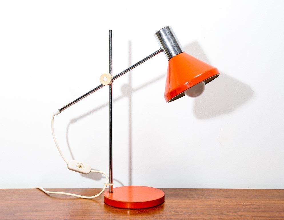 Vintage adjustable task lamp in bright orange. Manufactured in Holland, 1970s.