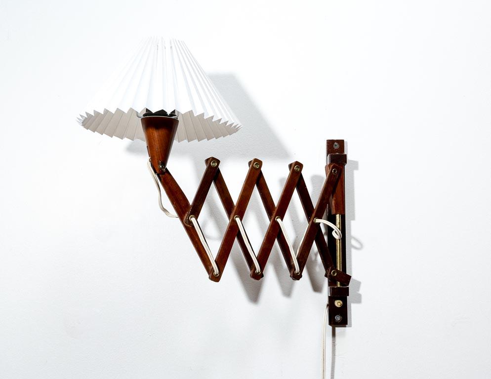 Vintage Dutch scissor lamp in teak with a pleated shade.