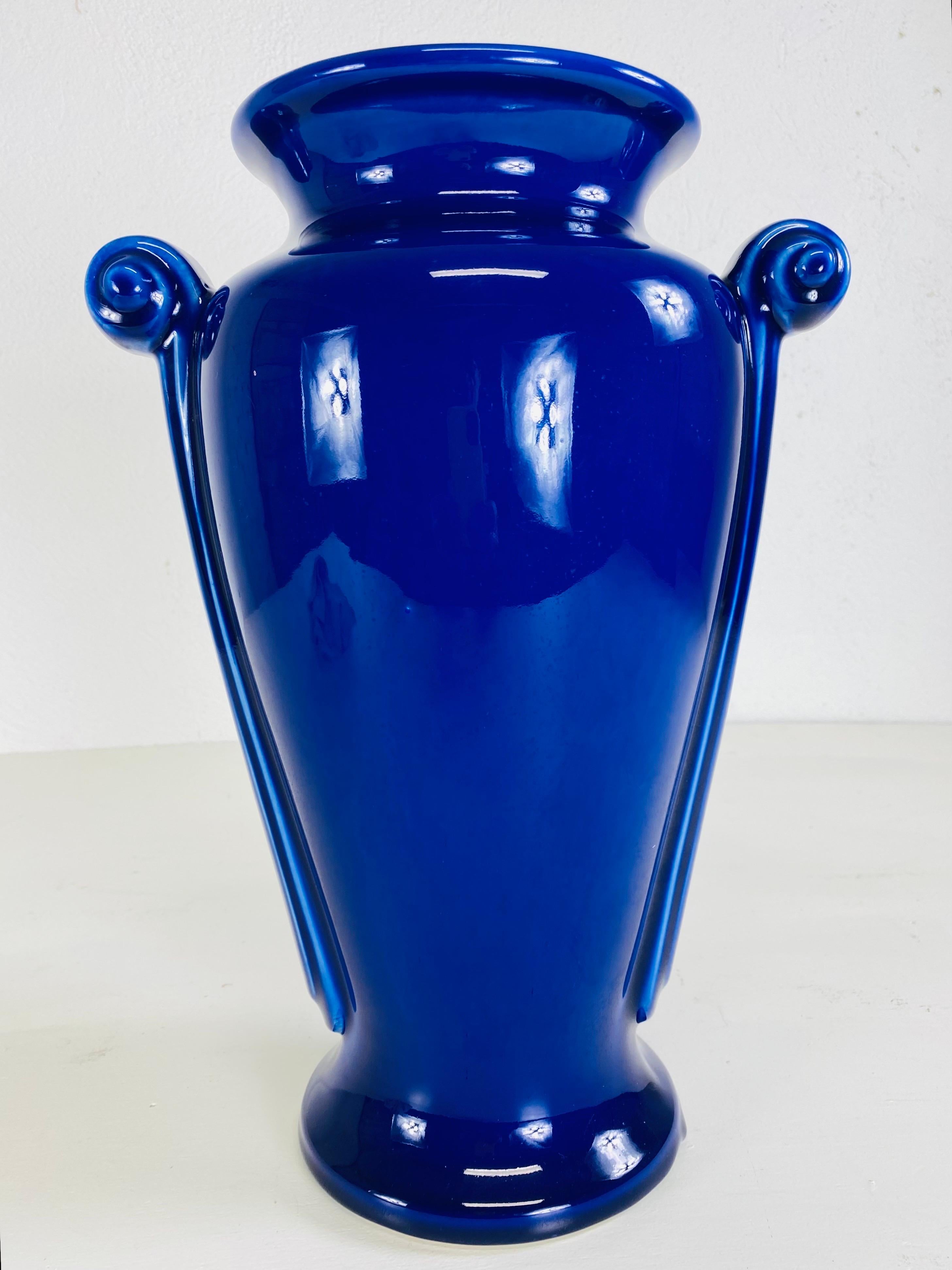 Hand-Crafted Vintage dynamic cobalt blue art deco style pottery vase. For Sale