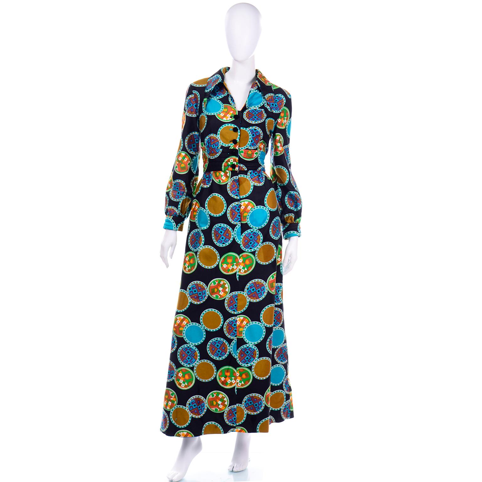 This is a pretty vintage Dynasty early 1970's collared maxi dress with a colorful circle medallion print. We always grab these Dynasty dresses whenever we can find them because they were so well made in such beautiful fabrics. This  long sleeve maxi