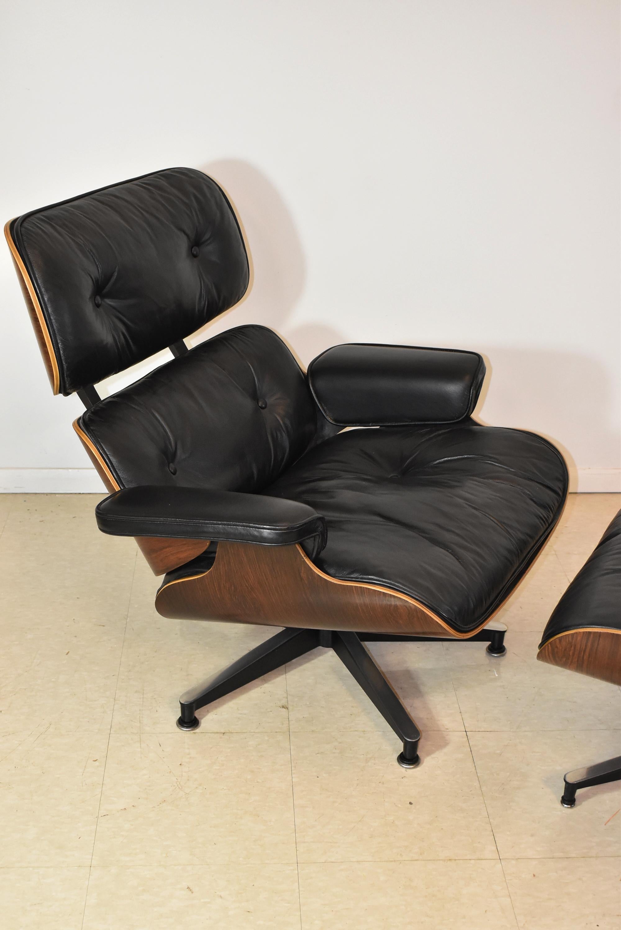 Modern Vintage Eames Black Leather and Rosewood Chair and Ottoman