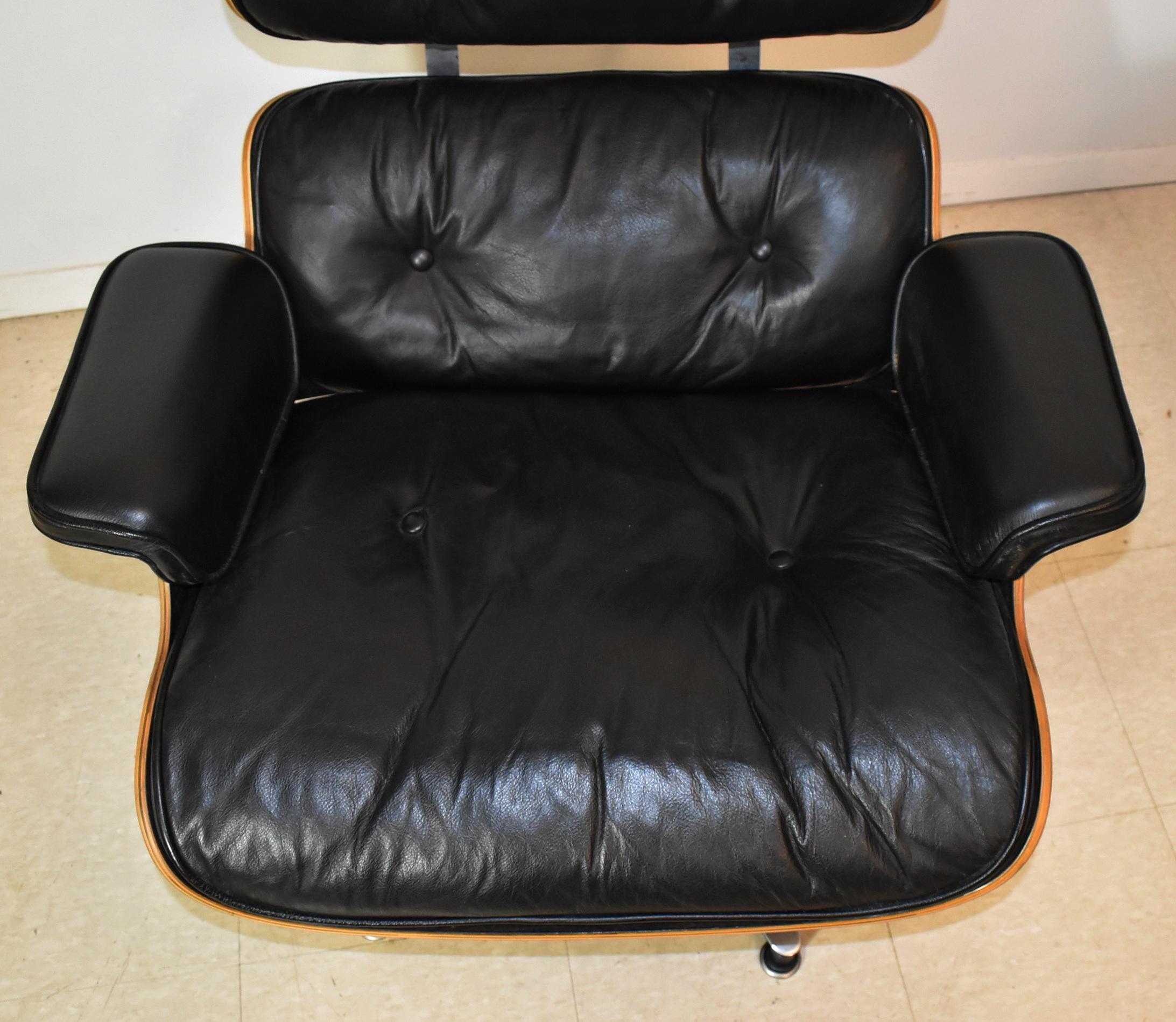 North American Vintage Eames Black Leather and Rosewood Chair and Ottoman