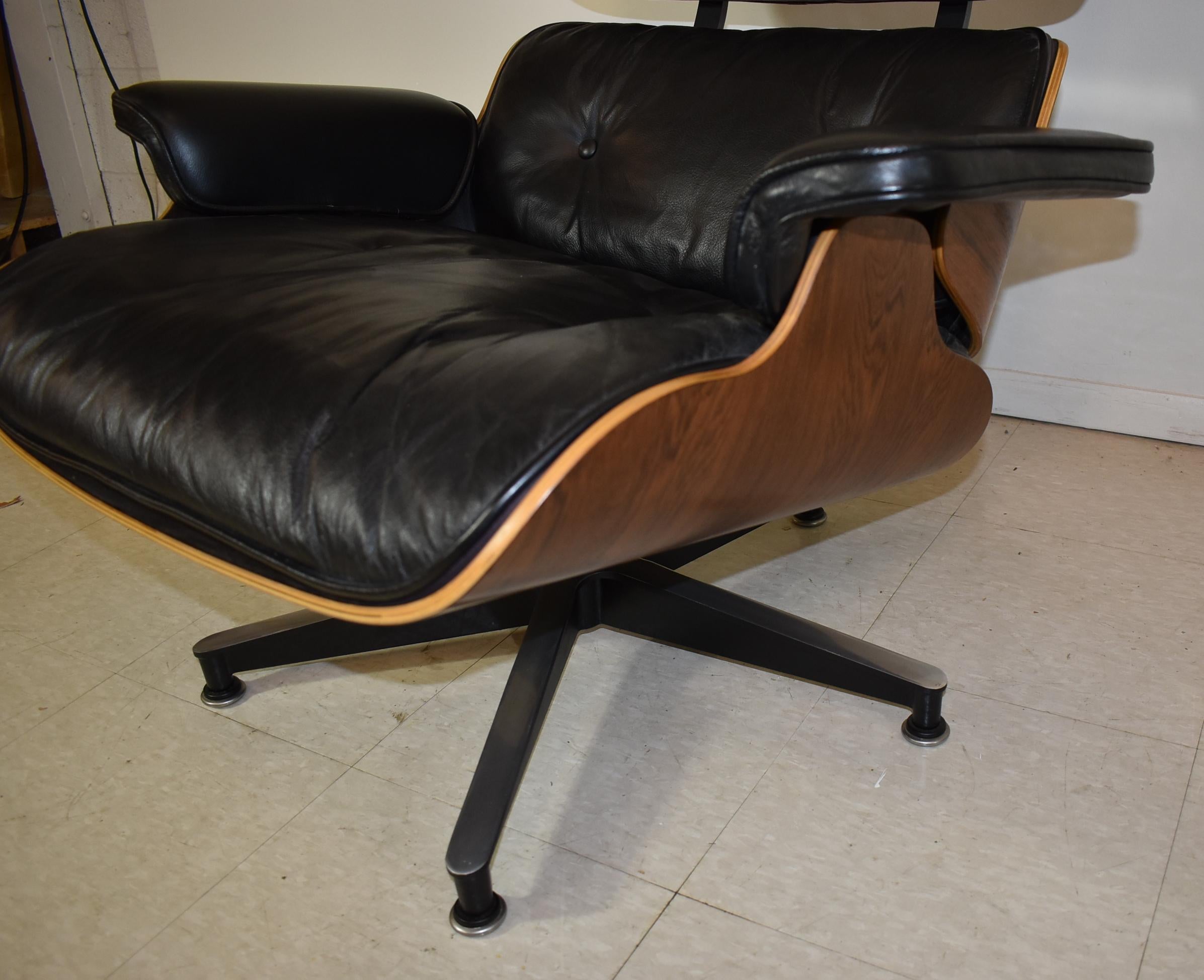 Vintage Eames Black Leather and Rosewood Chair and Ottoman In Good Condition In Toledo, OH