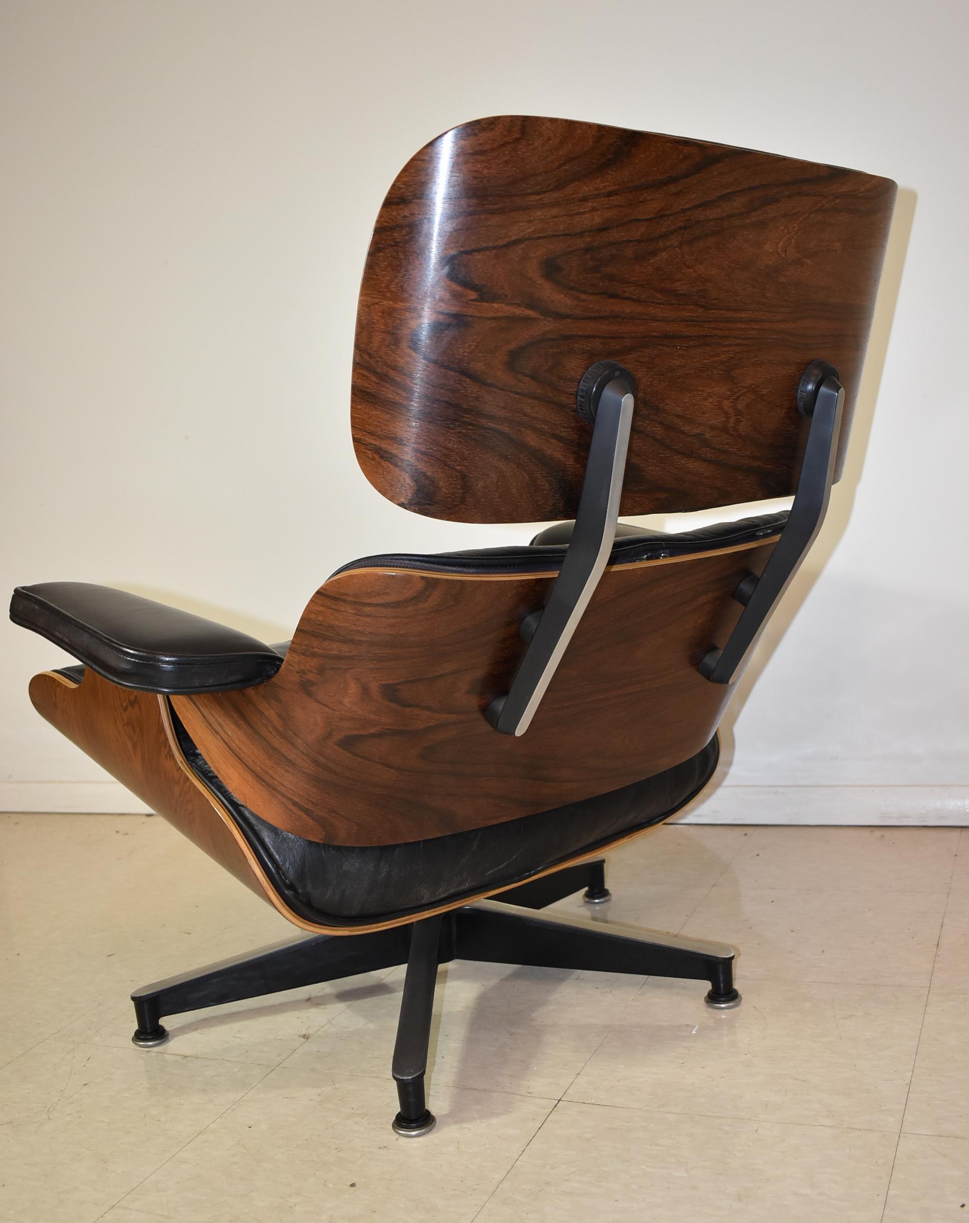 20th Century Vintage Eames Black Leather and Rosewood Chair and Ottoman