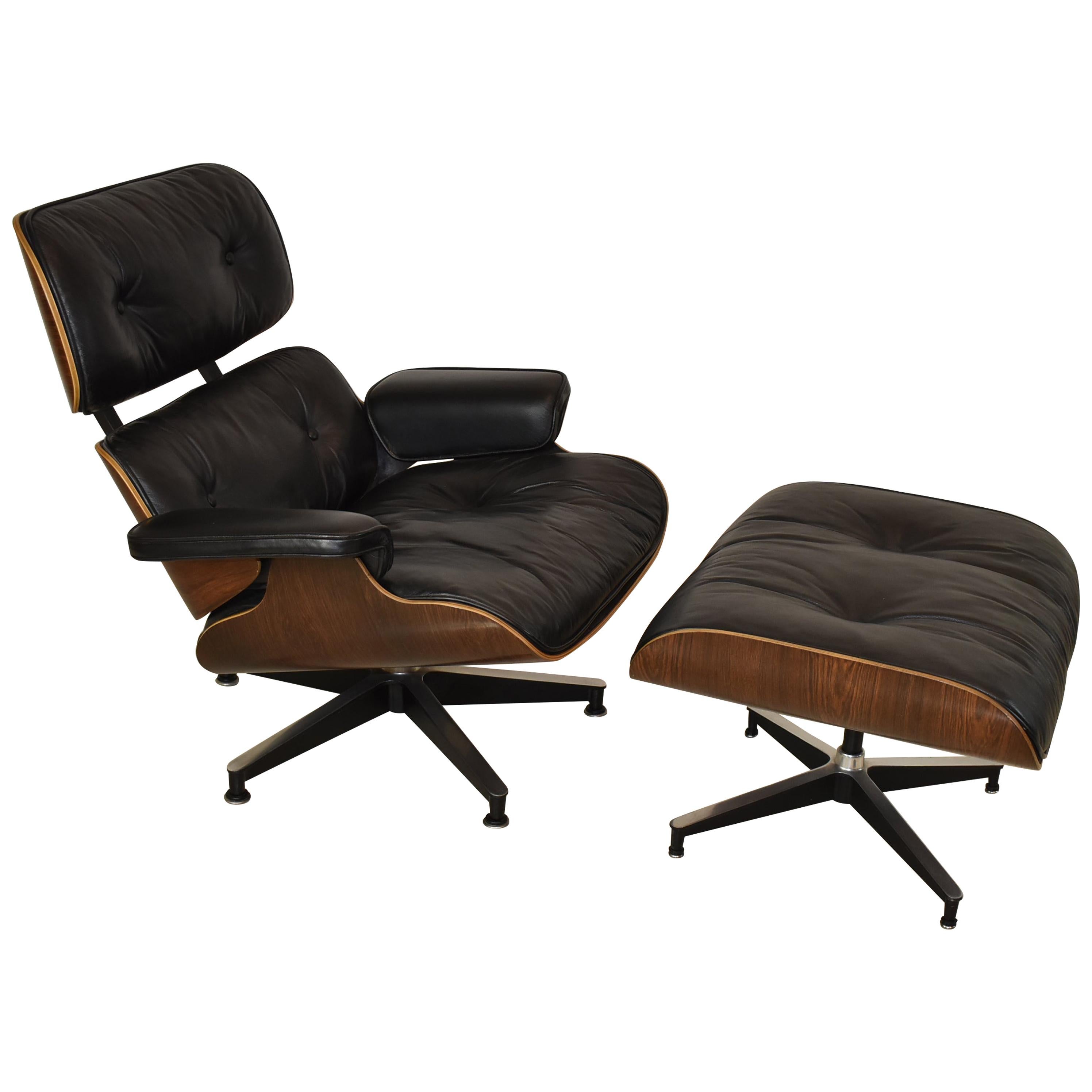 Vintage Eames Black Leather and Rosewood Chair and Ottoman
