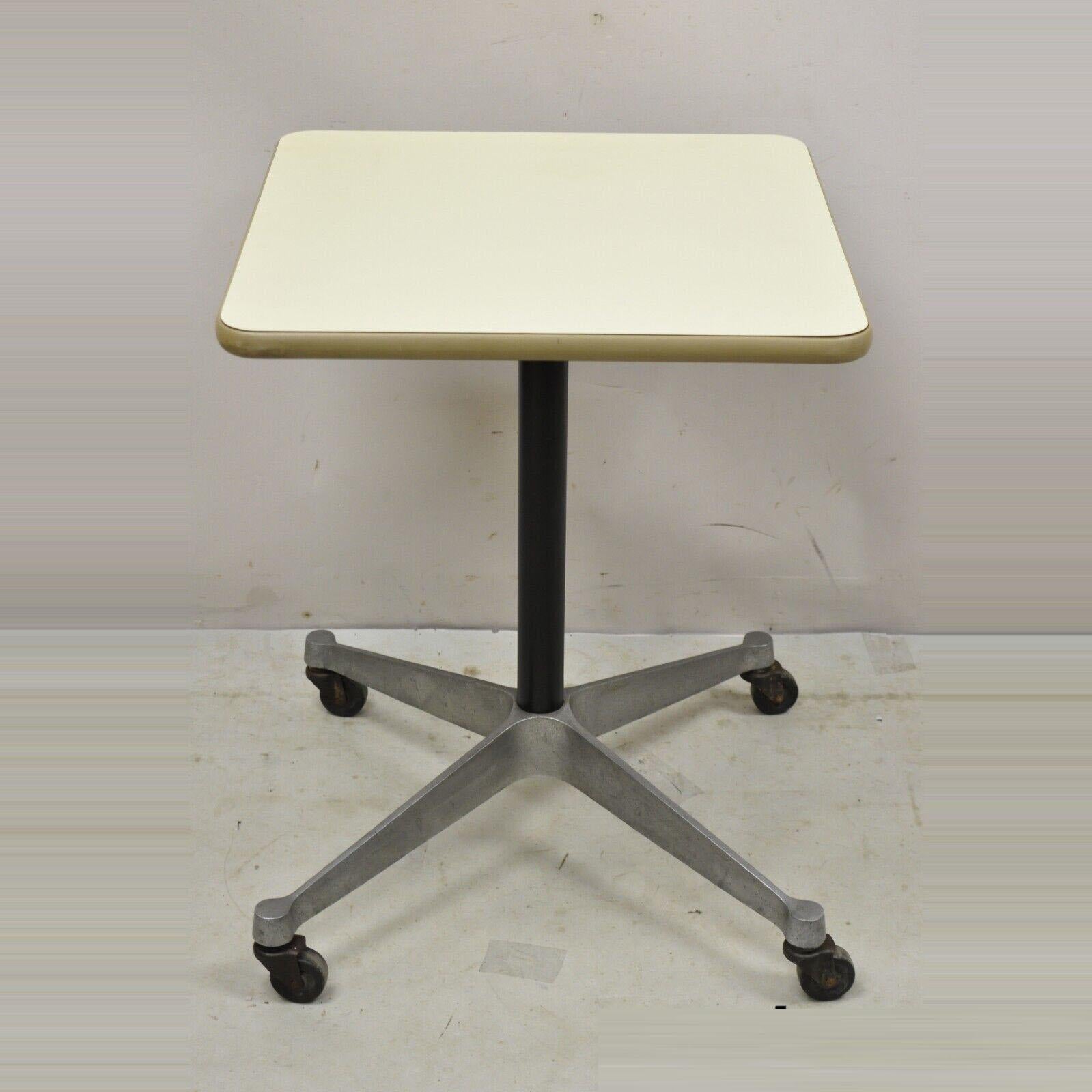 Vintage Eames Herman Miller Rolling Contract Side Table Mid-Century Modern. Item features off white laminate top, cast aluminum base, rolling wheels, original label, quality American craftsmanship, great style and form. Circa Mid to Late 20th