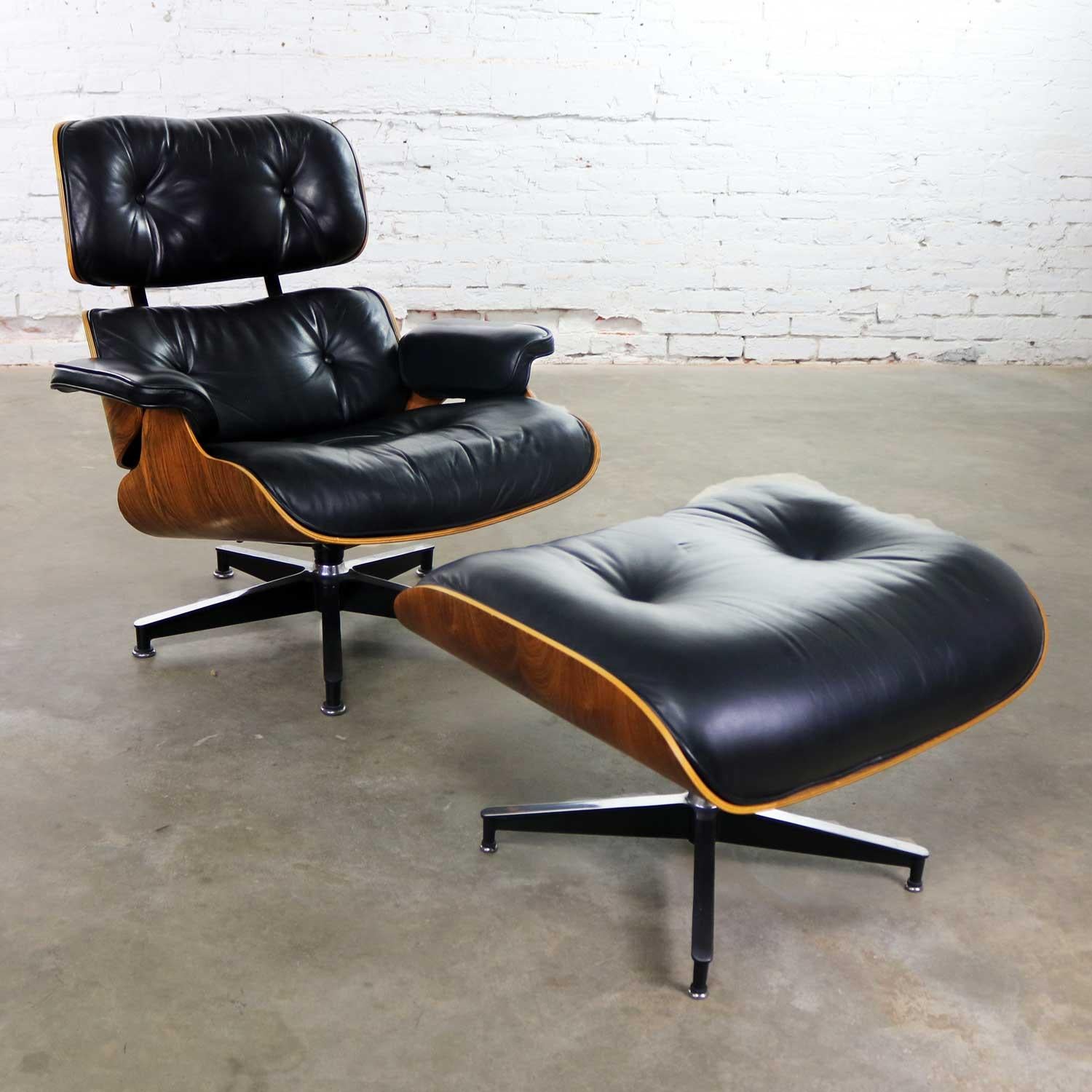 Handsome vintage Charles and Ray Eames designed black leather and rosewood 670 lounge chair and 671 ottoman for Herman Miller. They are both in wonderful vintage condition with no outstanding flaws. The leather on the ottoman does have a small