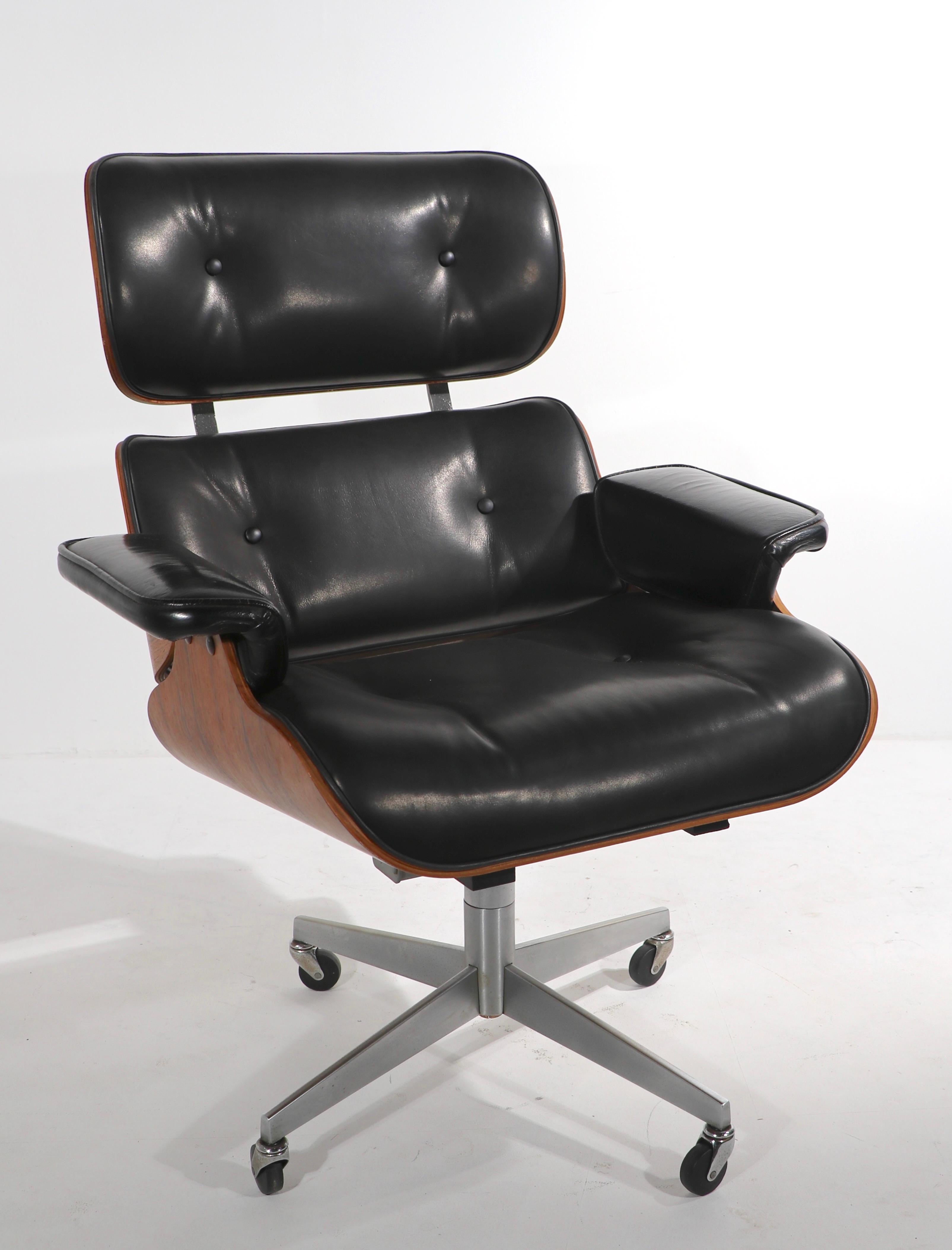 Vintage Eames Style Lounge Chair and Ottoman in Rosewood and Leather at