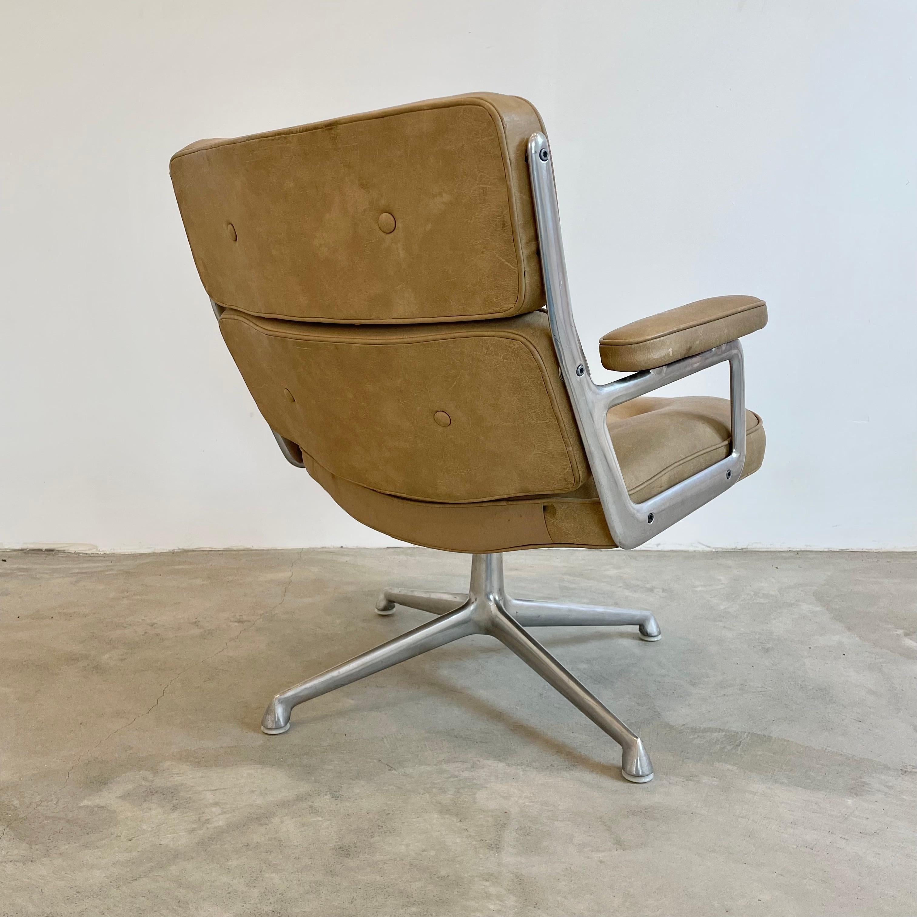 Classic Eames Time Life Lobby swivel chair in camel Skai for Herman Miller. Great color. Chair swivels. Metal and Skai are in good condition with wear as shown. Offered with original plastic caps or new casters. The perfect vintage office chair.