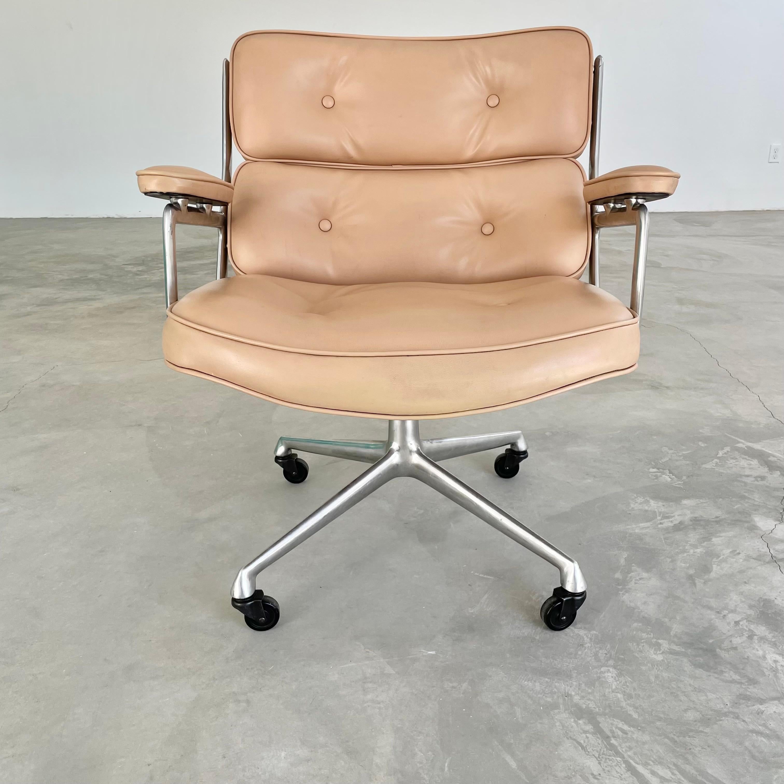 Classic Eames Time Life Lobby swivel chair in camel Skai for Herman Miller. Great color. Chair swivels. Metal and Skai are in good condition with wear as shown. Offered with original casters. The perfect vintage office chair. Extremely comfortable.