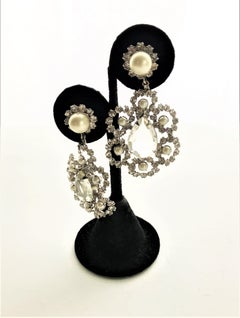 Vintage clip-on earrings sign. K.J.L. Rhodium with rhinestones, faux pear 1960s