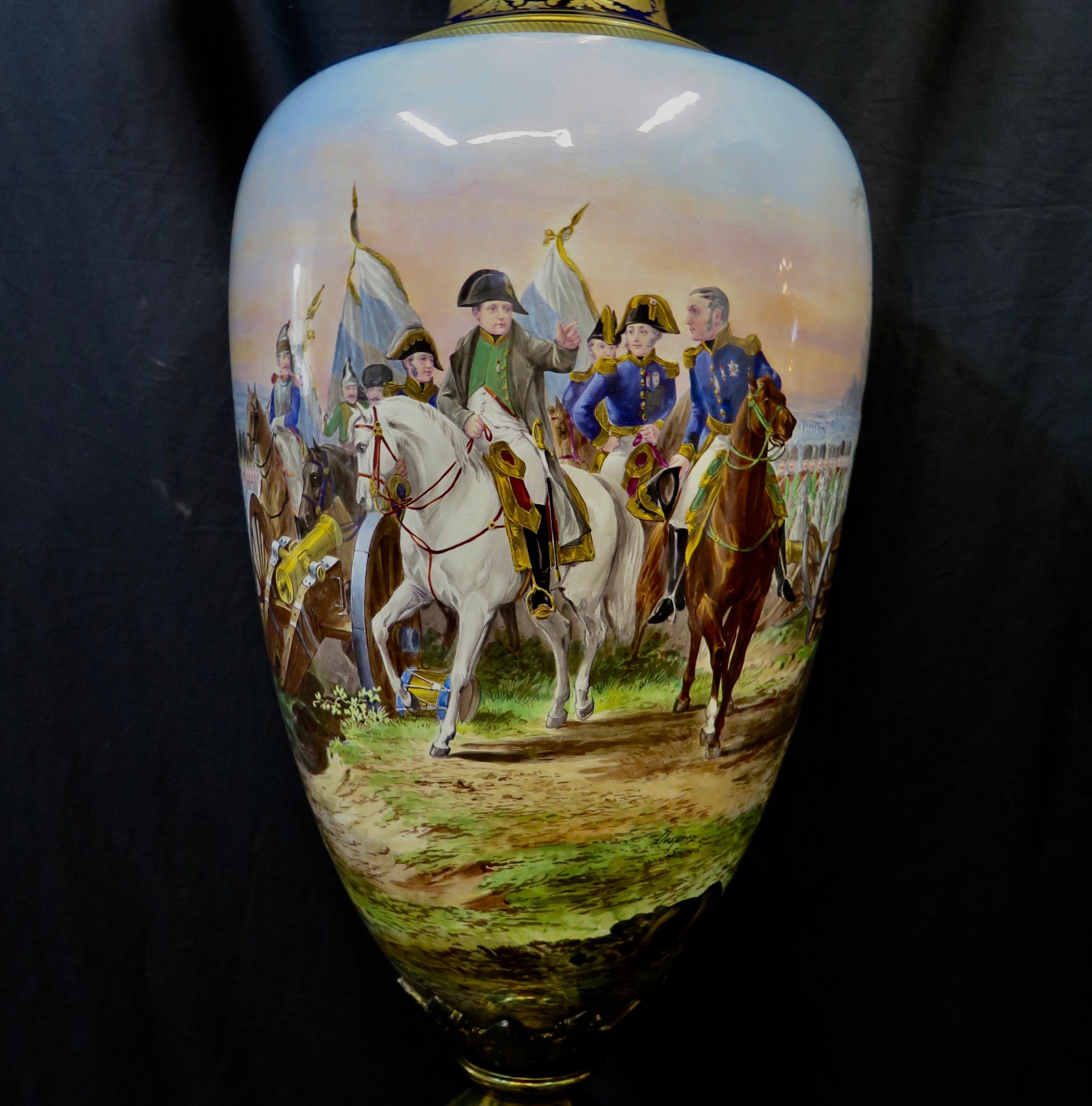 This vintage palace size Sevres porcelain covered urn is elaborately hand painted with a historical scene of Napoleon on horseback on the battlefield with his troops. The artist, Desprez painted this colorful detailed painting surrounding the entire