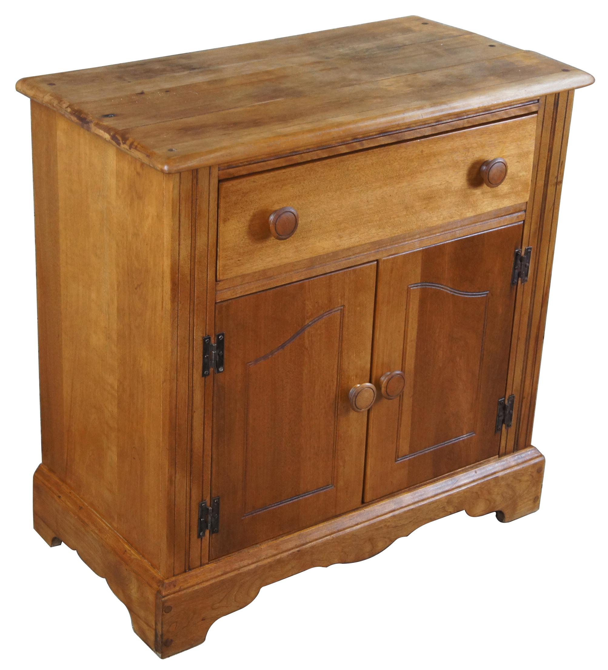 American Country pine cabinet. Features a dovetailed drawer, lower cabinet for storage. The cabinet is supported by bracket feet.