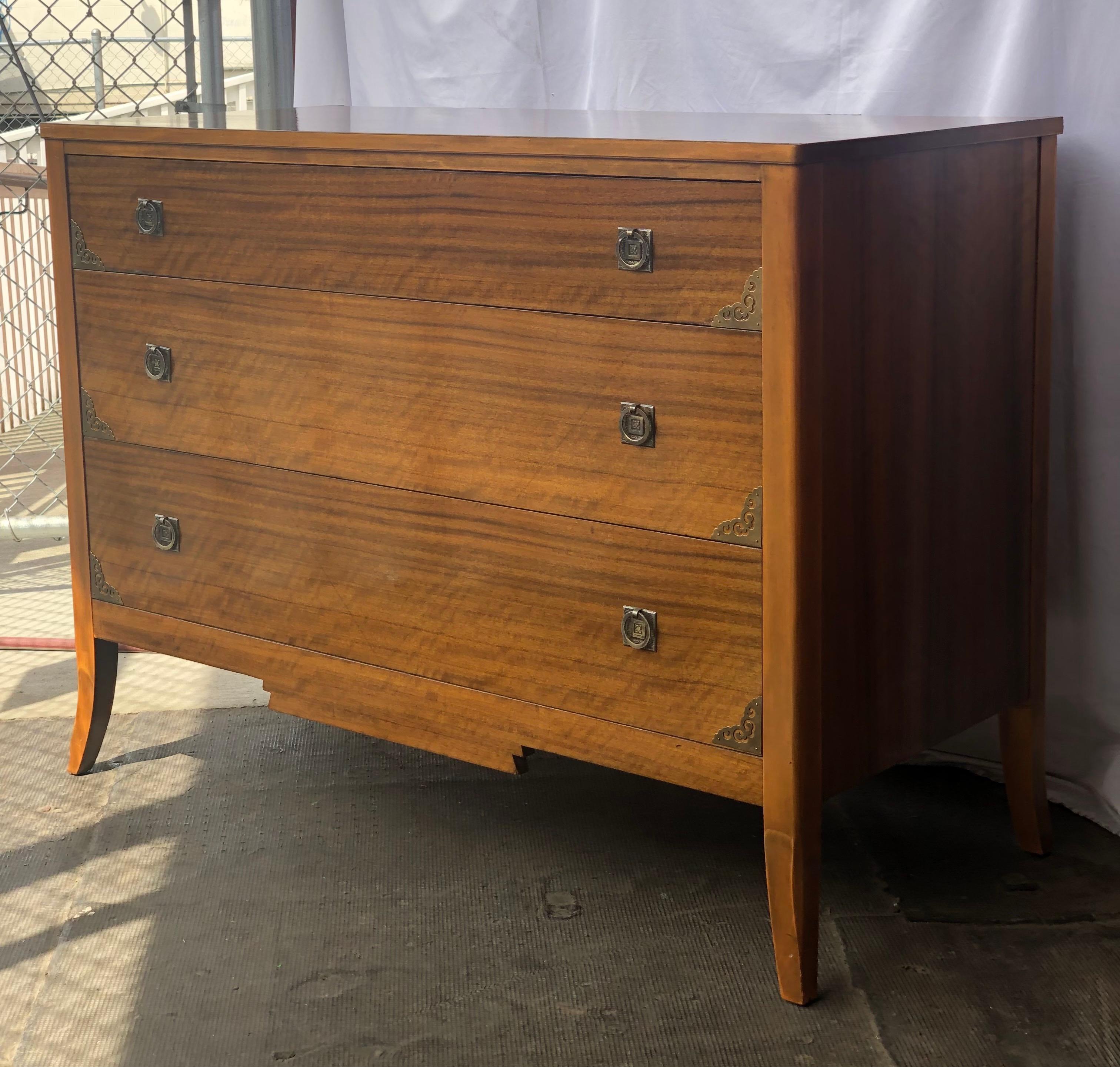 Vintage dresser in walnut and Oak with brass accent. Sturdy and sleek design with original hardware.