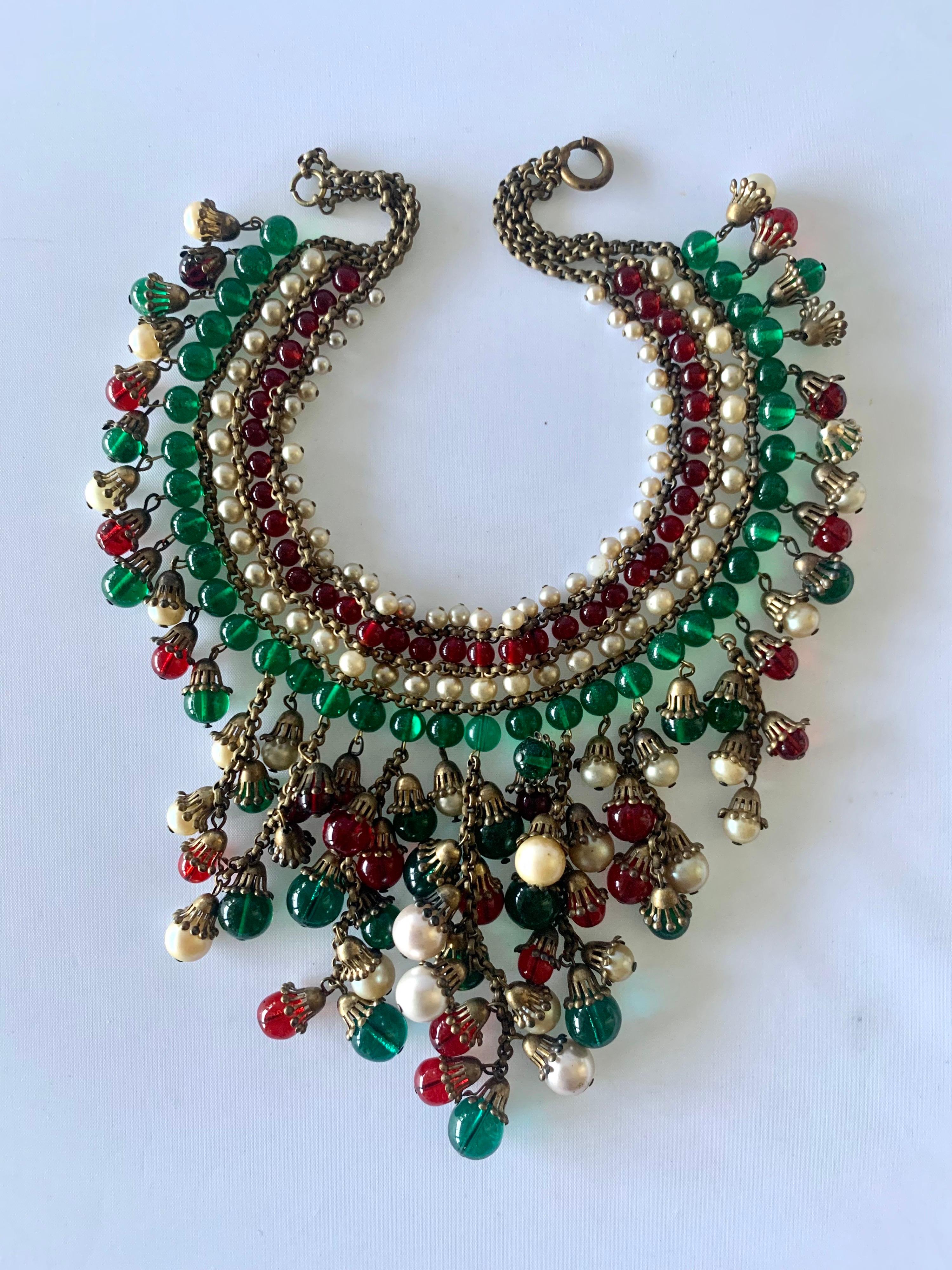 Important early Coco Chanel fringe metal chain statement necklace - comprised out of hundreds of green and red glass beads by Maison Gripoix and cream-colored pearls by Maison Rousselet. The beads, pearls, and metal findings have been assembled in a