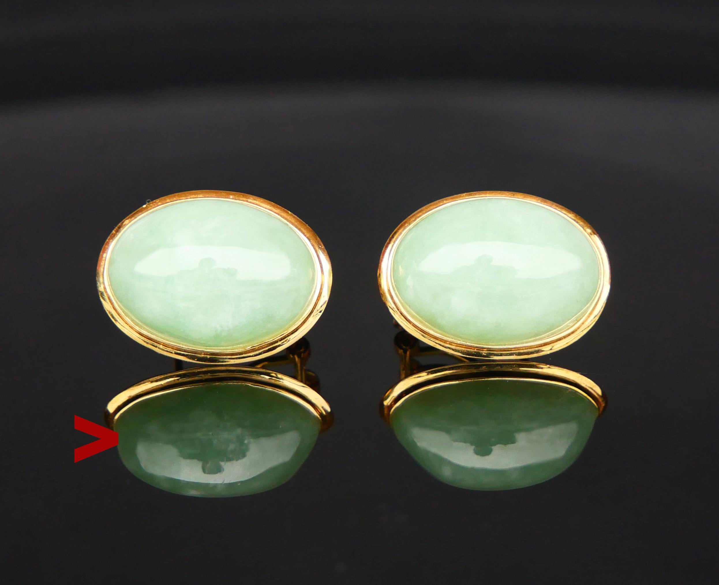 A pair of nice vintage clips in solid 14K Yellow Gold with bezel set cabochons of natural translucent Celadon colored Jade stones 17 mm x 13 mm x 7. 25 mm deep or ca. 13 ct each. These stones look a bit bluish in natural light.

Each bezel 20 mm x