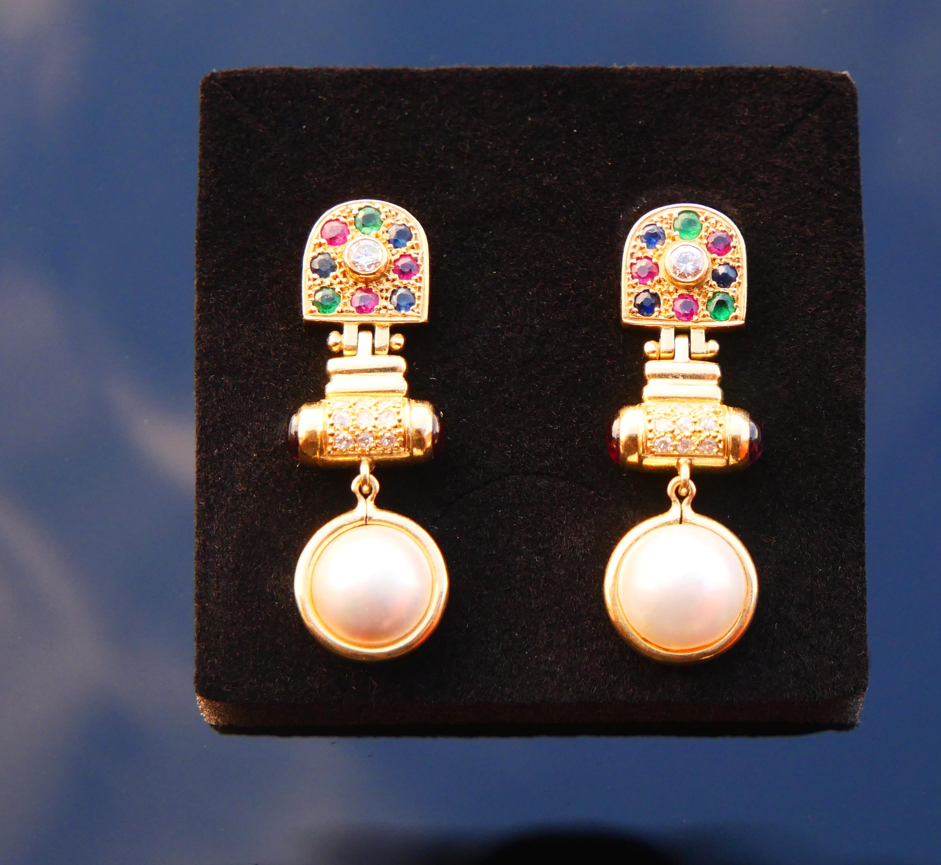 
A pair of amazing vintage earrings from ca. 1970s in tested solid 18K Yellow Gold. Each earring is built of three hinged and mobile sections decorated with natural Diamonds, Rubies, Sapphires, Emeralds, Tourmalines and Mabe Pearls .

Each earring