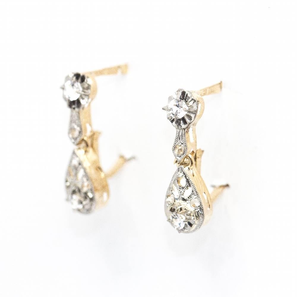 Original 1910's earrings in Yellow Gold and Platinum for woman : 10x Brilliant Cut Diamonds, total weight approx. 0,12 cts : Catalan clasp : 18kt Yellow Gold and Platinum : 1,39 grams : Length 15mm : These earrings are in excellent condition,