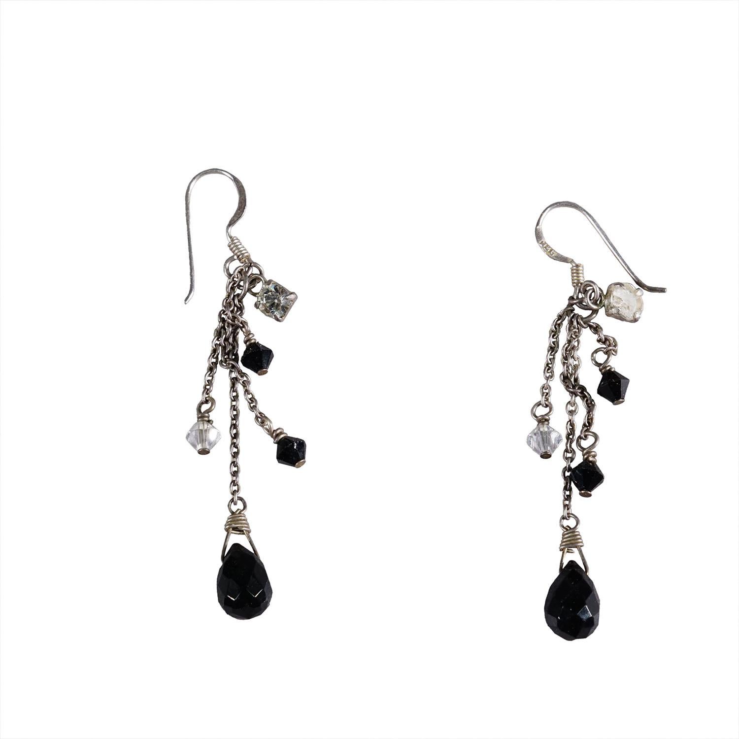 Vintage Earrings with Black Pearls and Rhinestones, Germany ca. 1950s

A pair of beautiful traditional earrings with black pearls and rhinestones. Made from 925 sterling silver. The earrings have chains of varying lengths, with stones and pearls