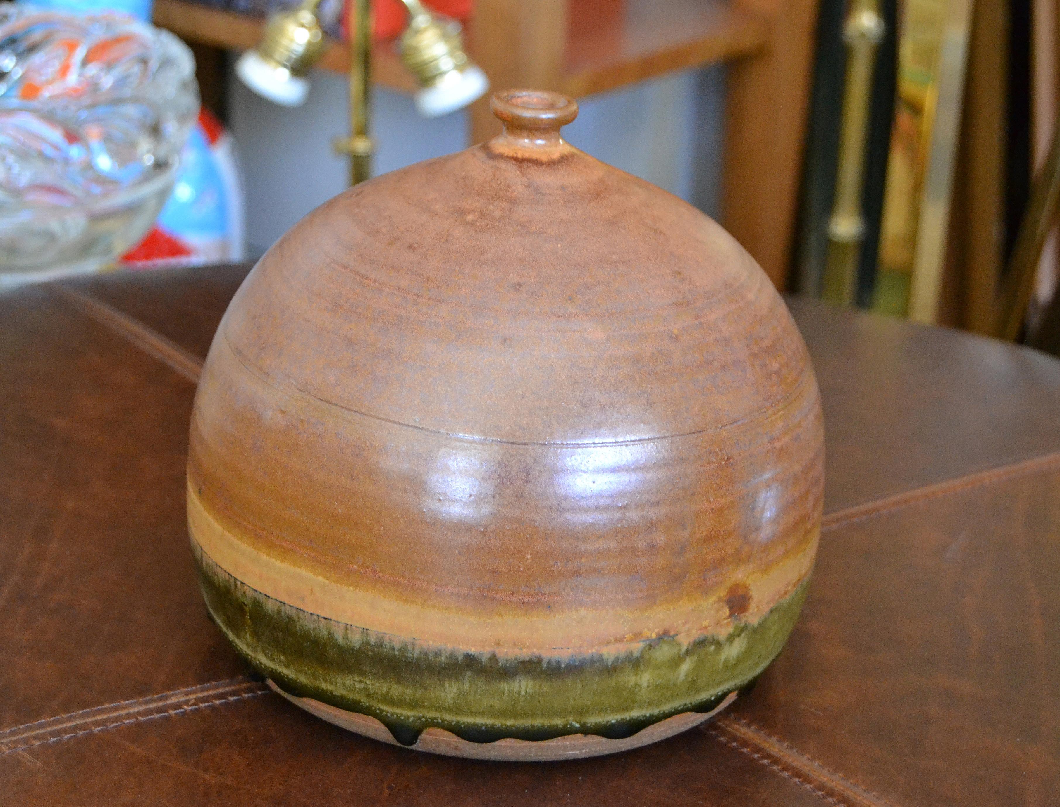 Vintage earthenware handcrafted brown and green terra studio with dark green drip glaze bud or weed vase.
Stamped at the base.
Pottery Art in superb craftsmanship.