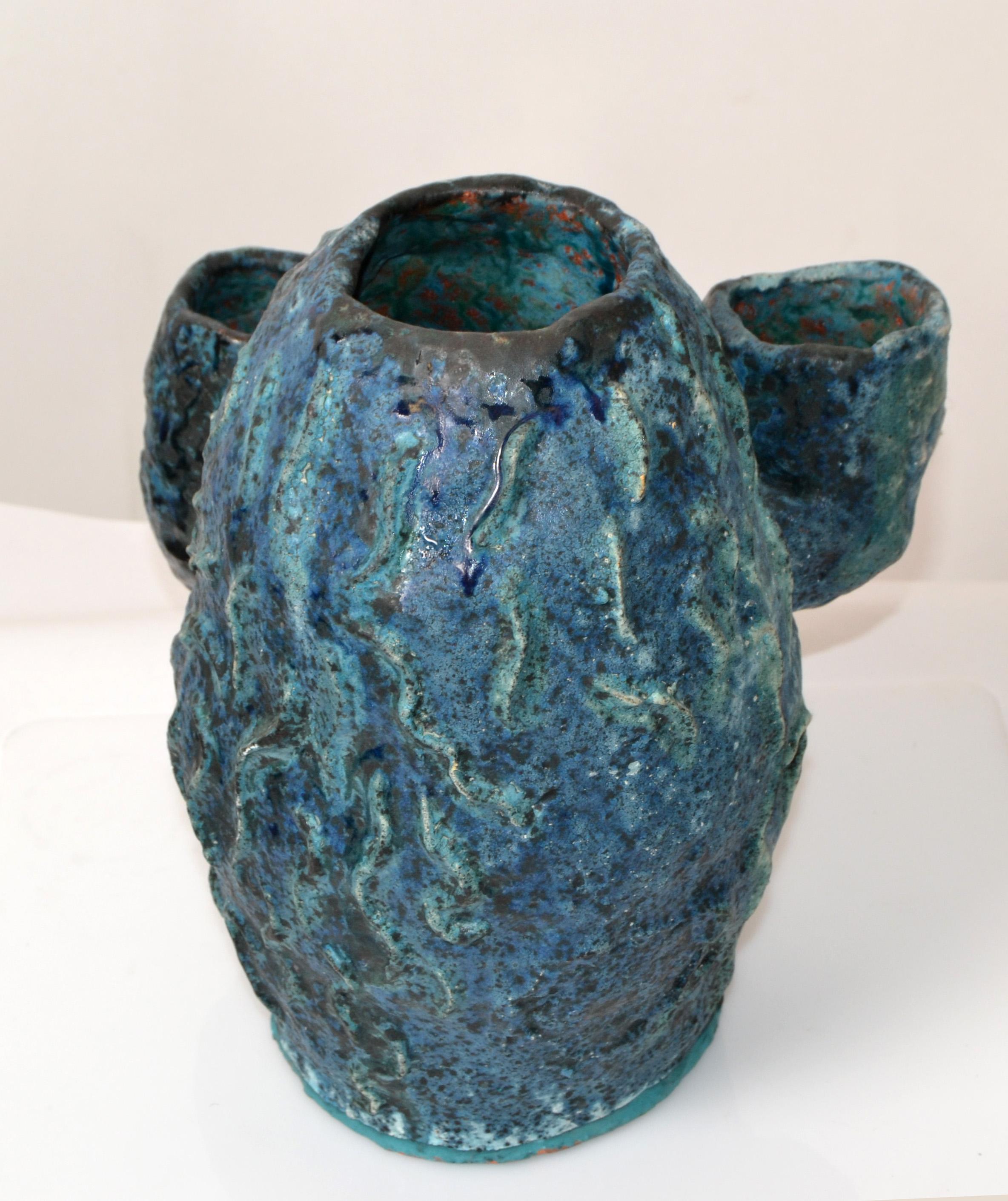 Vintage earthenware handcrafted Hues of blue studio piece with drip glaze vase, planter, vessel.
Pottery Art in superb craftsmanship.
No Markings found.