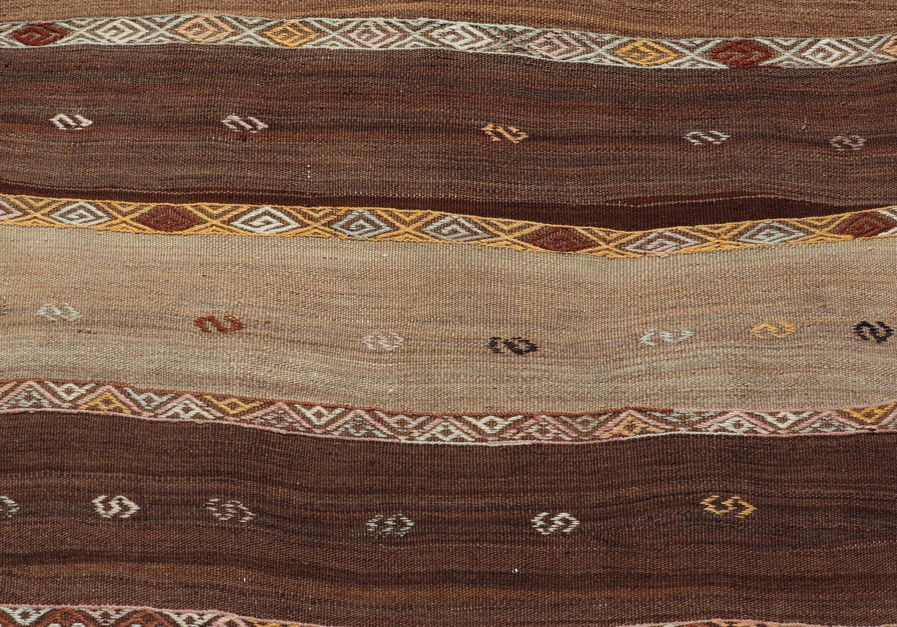 Vintage Earthy Kilim Gallery Runner with Stripe Design in Multi Colors & Motif's. Keivan Woven Arts / rug EN-178669, country of origin / type: Turkey / Kilim, circa 1950.
Measures: 4'6 x 11'7 
Featuring a striking stripe design, this unique
