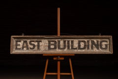 Vintage “East Building” Painted Wood Directional Sign