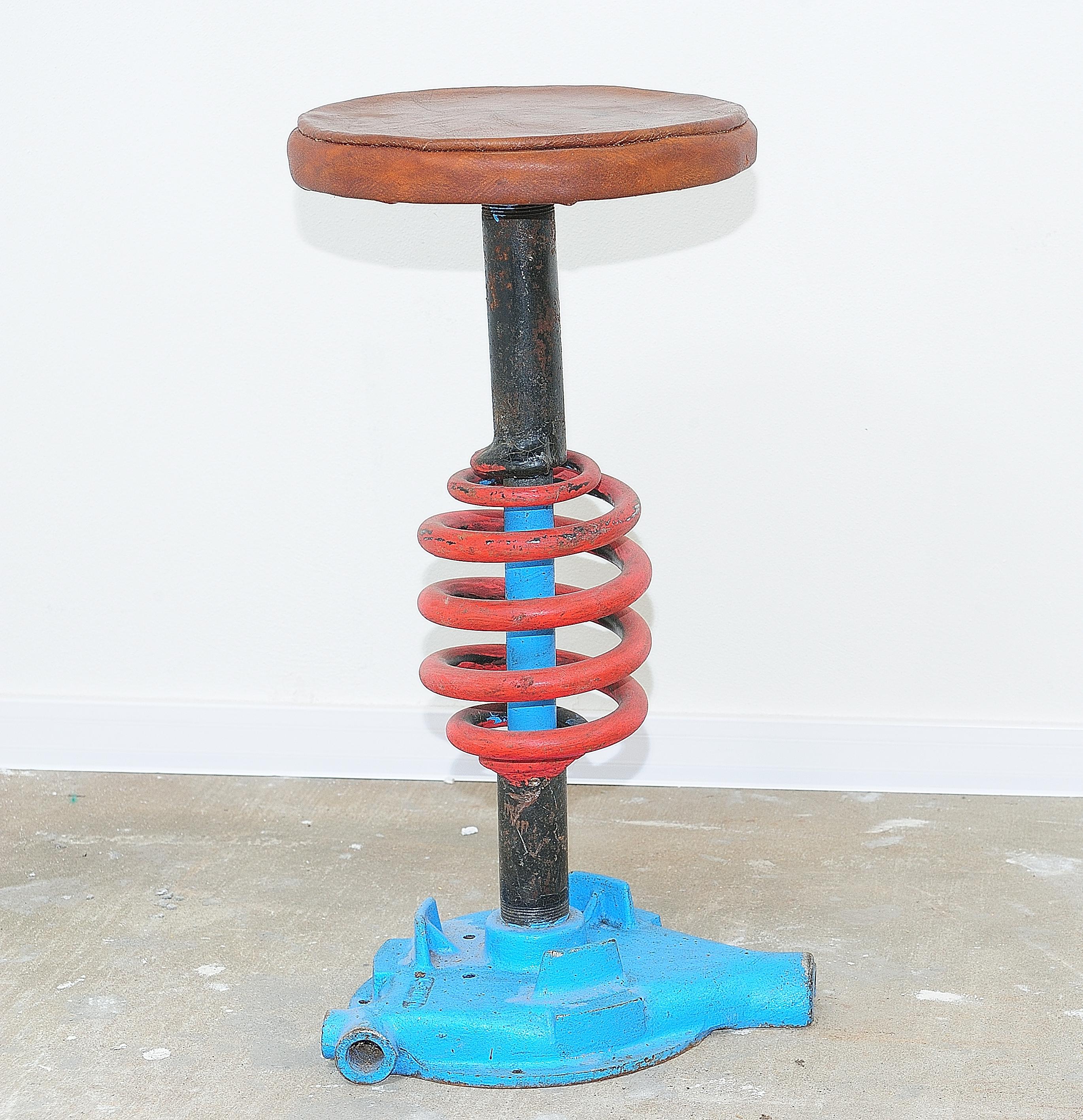 Czechoslovak vintage Industrial stool, made in the 1970s. It features an unconventional design. It was made of iron and leather. In good preserved vintage condition, signs of time and wear create an interesting and engaging patina to this piece.