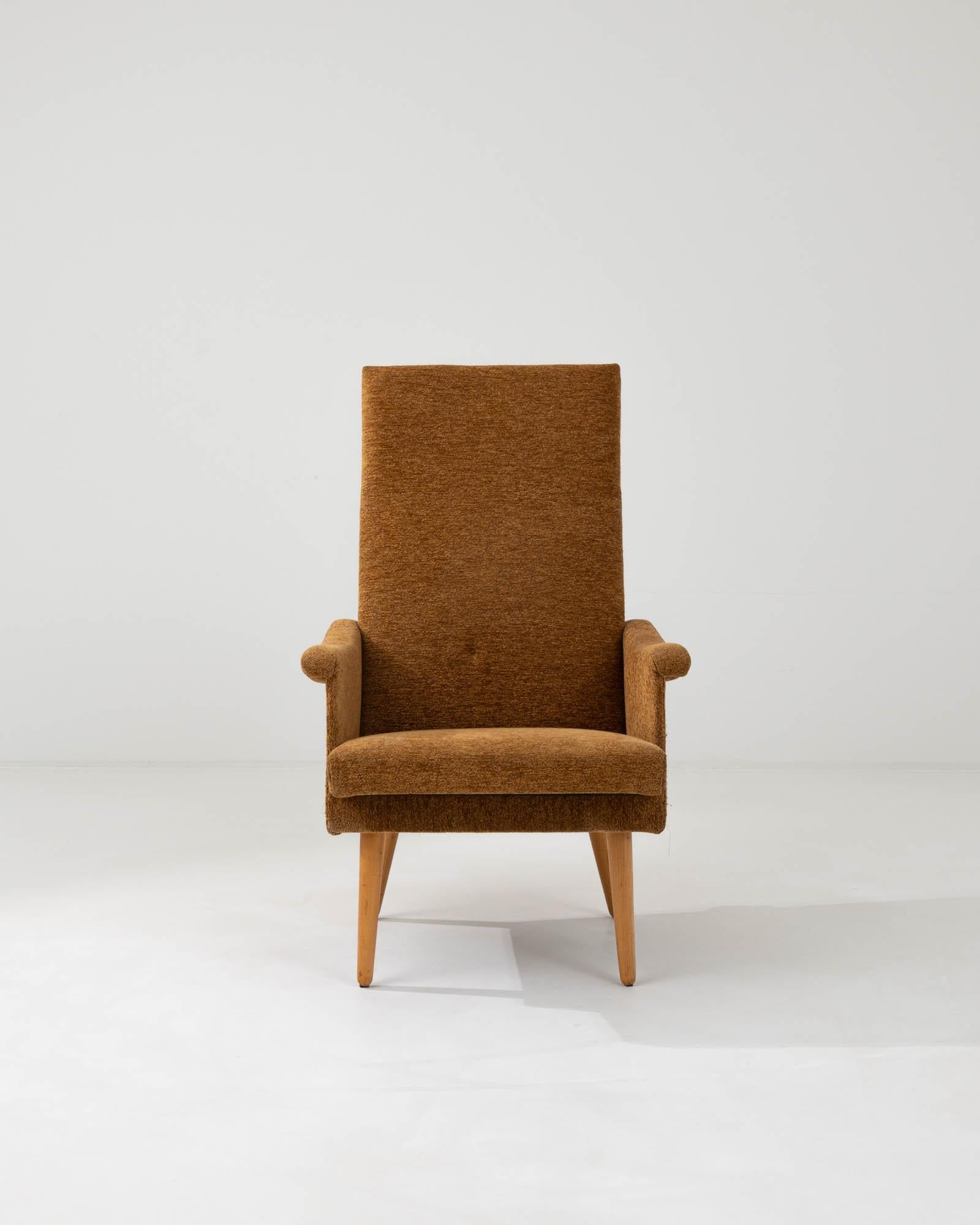 The boucle upholstering of this chair matches its legs’ warm earthy color. The soft curves of this Eastern European modern Czech chair from the twentieth century hold an everlasting style and elegance that has endured for decades, taking influences
