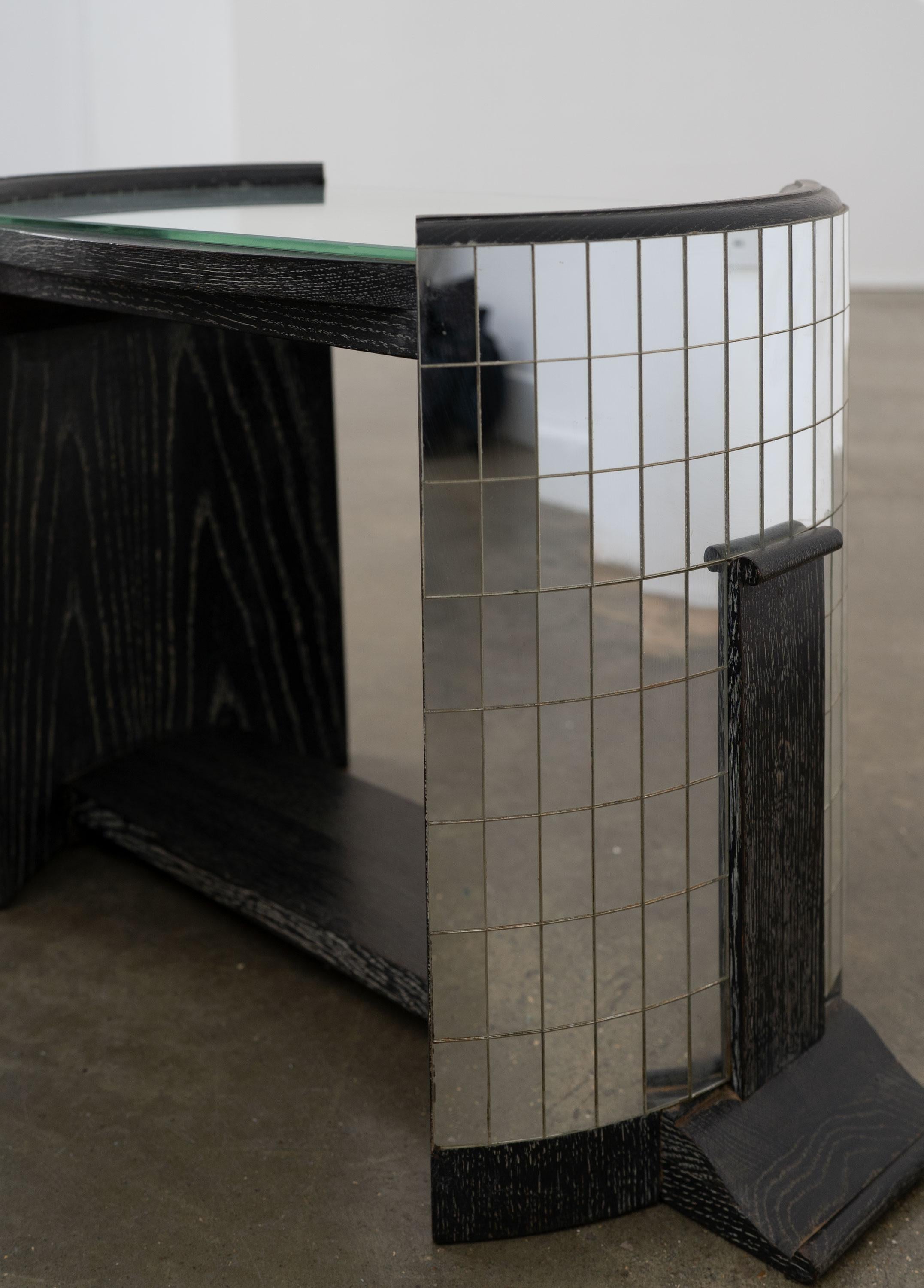 A very good and highly unusual 20th Century side table, made from ebonised and limed oak and featuring mosaic mirror tiled sides and mirror top. It is a well made piece that is part of a collection of items from the same unattributed maker/designer.