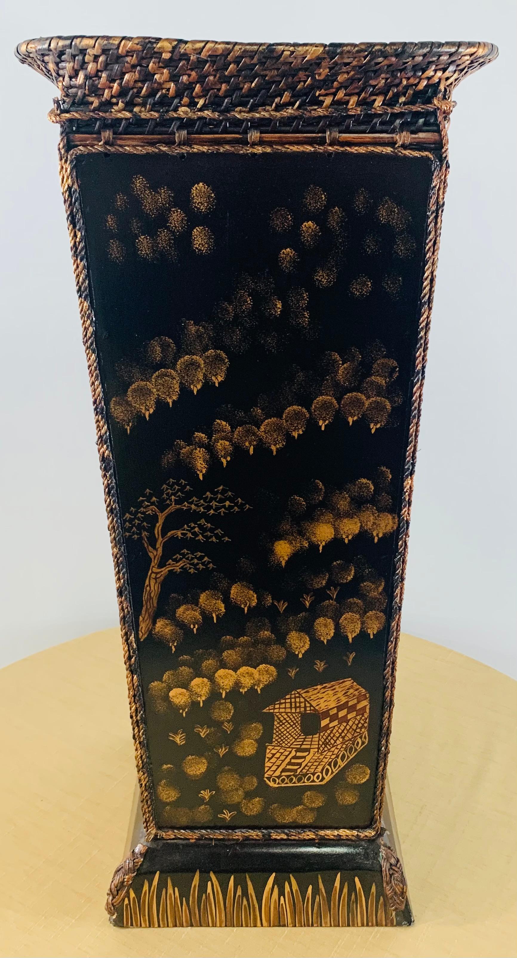 A stylish large square modernist shape planter or jardiniere adorned with gilt decoration on a dark ebonized background. Each panel is nicely hand painted with trees and plants motifs. The mouth of the planter is decorated with waved cane as well as
