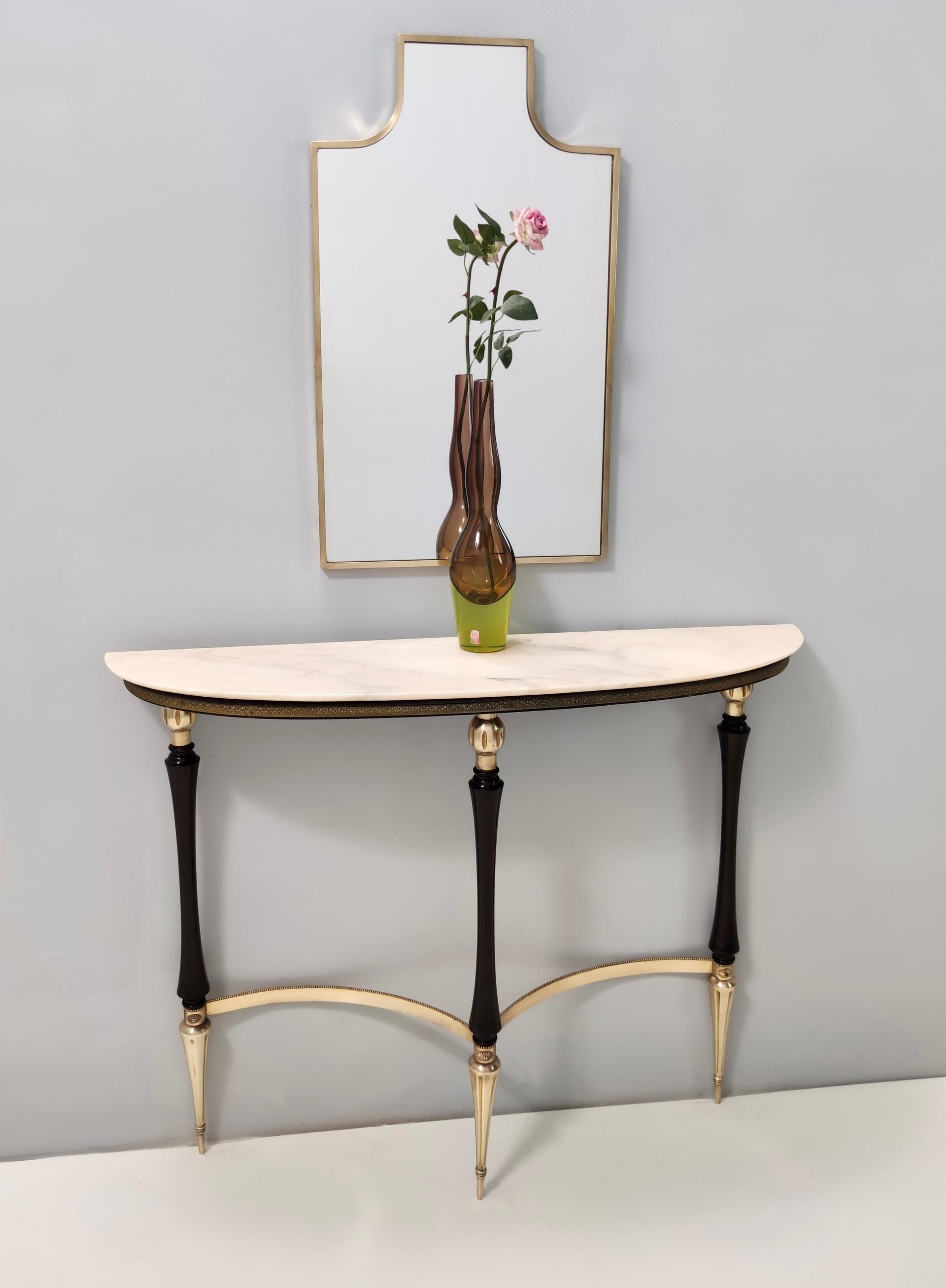 Italy, 1950s.
It features an ebonized beech frame, brass parts and feet caps and a Portuguese pink marble top.
It might show slight traces of use since it's vintage, but it can be considered as in excellent original condition and ready to become a