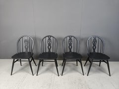 Vintage ebonized dining chairs by Ercol, 1950s