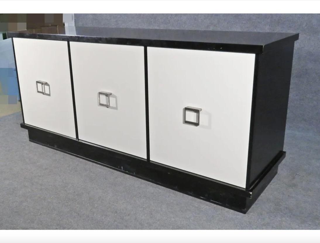 With beautiful ebonized panels and metal pulls, this vintage sideboard is full of timeless style. Please confirm item location with seller (NY/NJ).