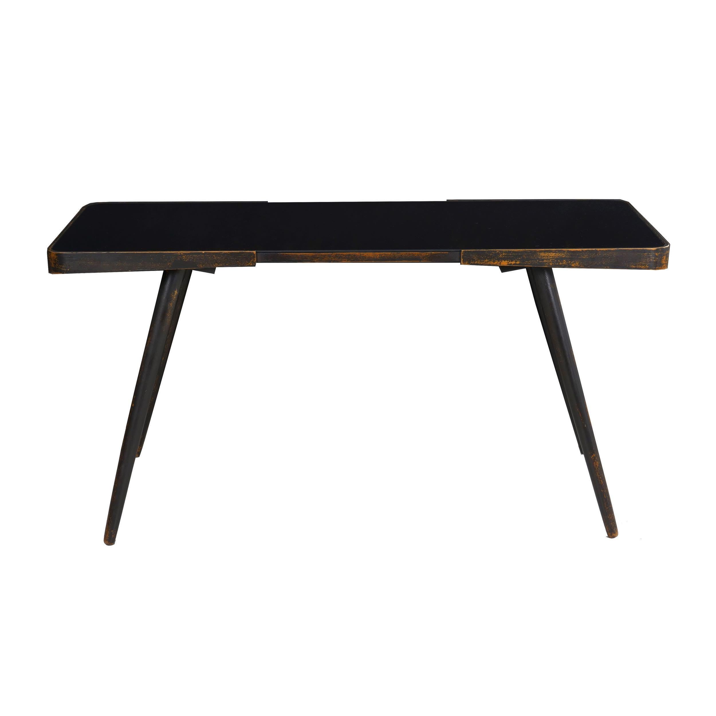 Vintage ebonized beech splay-legged cocktail table with black glass
Continental, circa 20th century
Item # 010PKT22L 

An incredibly sleek and attractive cocktail table, it is a beautifully crafted work of elegance. The frame is formed from