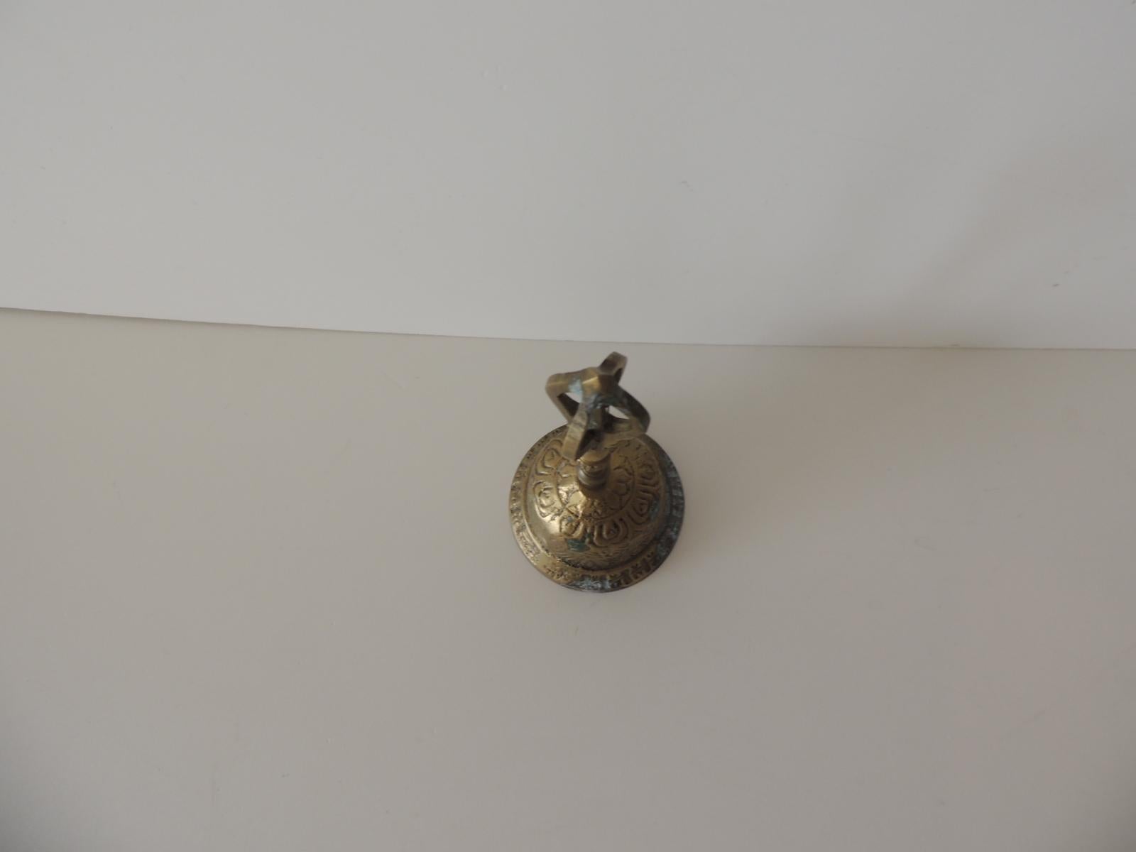 Vintage edged brass petite table bell.
(So discoloration on brass from age.)