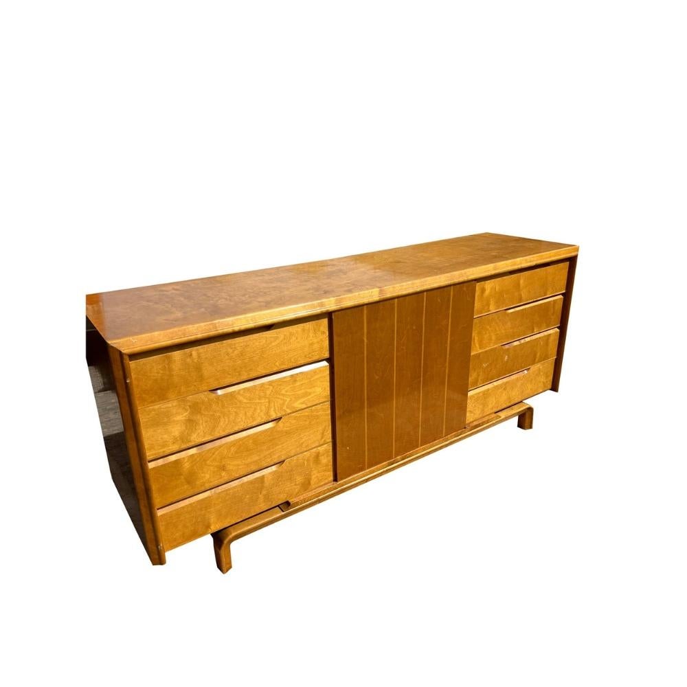 Vintage Edmond Spence Swedish Credenza or Long Dresser in Mid-Century Modern Style
This Mid-Century Modern credenza or long dresser by Edmond Spence, crafted in Sweden during the 1960s, exemplifies the essence of Scandinavian design and expert