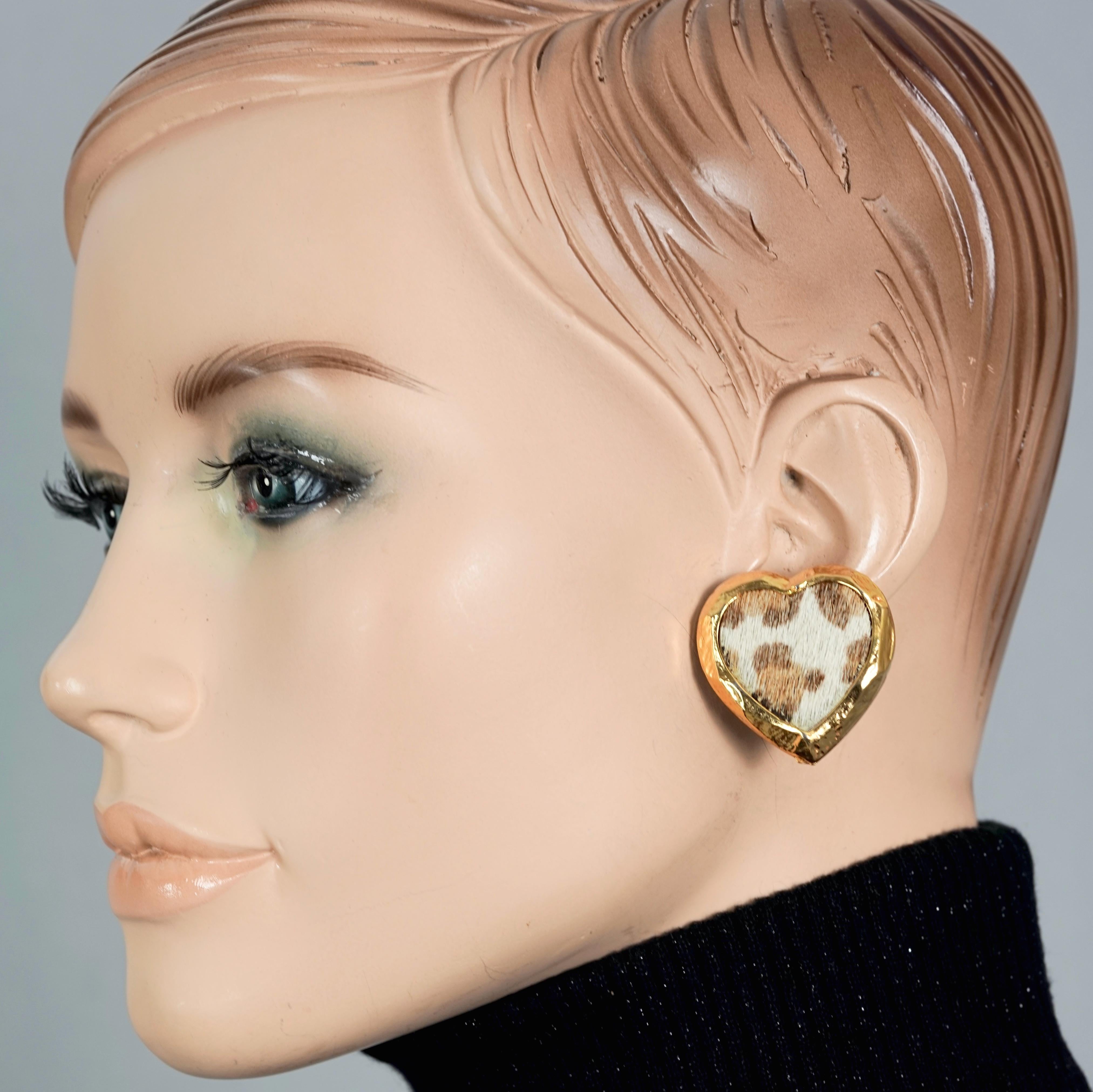 Vintage EDOUARD RAMBAUD Heart Faux Fur Leopard Gilt Earrings

Measurements:
Height: 1.33 inches (3.4 cm)
Width: 1.29 inches (3.3 cm)
Weight per Earring: 13 grams

Features:
- 100% Authentic EDOUARD RAMBAUD.
- Gilt heart earrings with faux leopard
