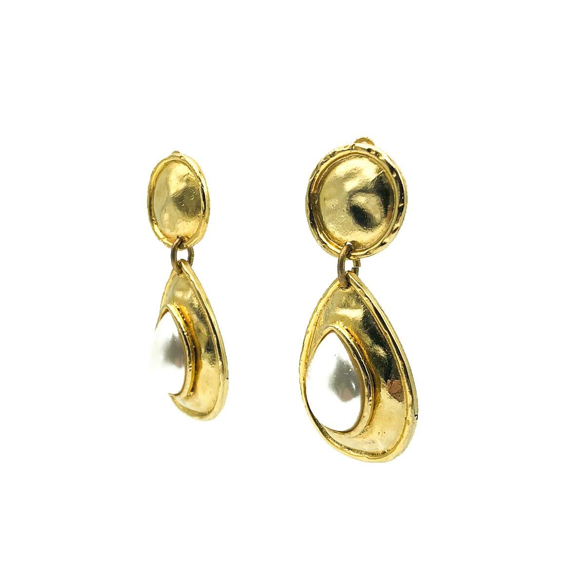 Vintage Edouard Rambaud Pearl Earrings. Crafted in hammered gold plated metal with large teardrop faux pearls. Very good vintage condition, signed, 8cms. An exquisite pair of French designer earrings that will always raise your game and easily