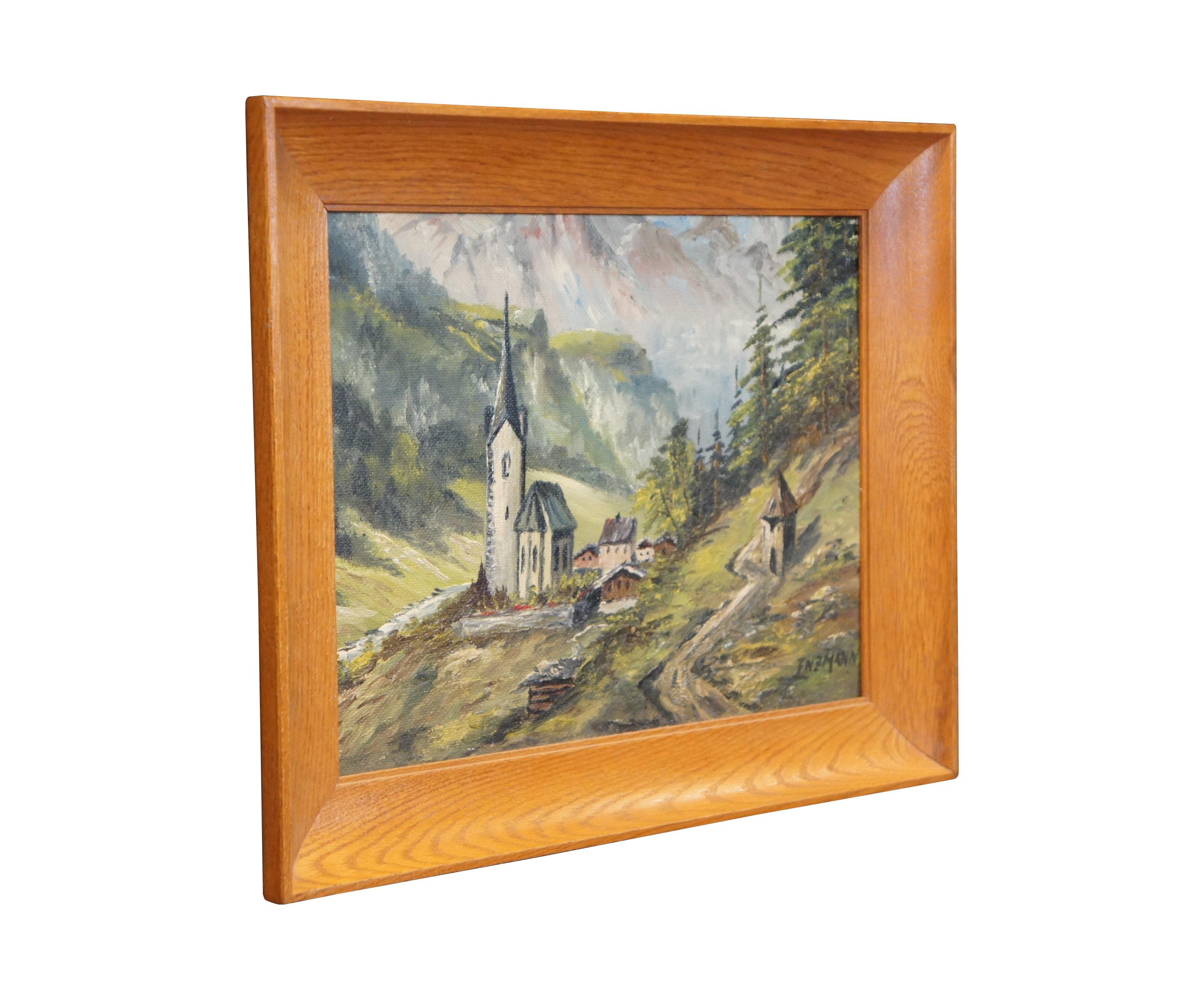 Early to mid 20th century oil on board landscape painting depicting a church steeple in a little Alpine mountain village. Signed Enzmann in lower right. Beveled wood frame.

