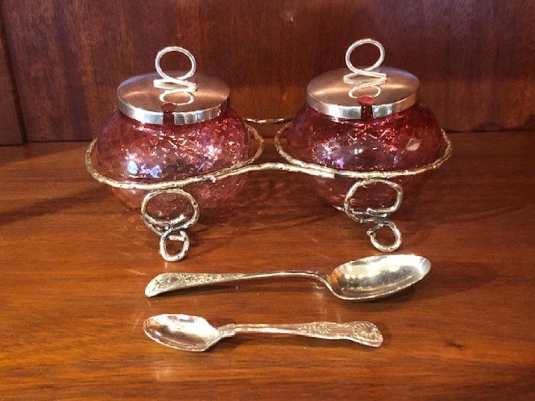 Brighten up your table with thee colorful Old Edwardian Cranberry Preserve Pots with Silver Plated Tops, Spoons and Shaped Stand From England.  Spoons are not the same.
