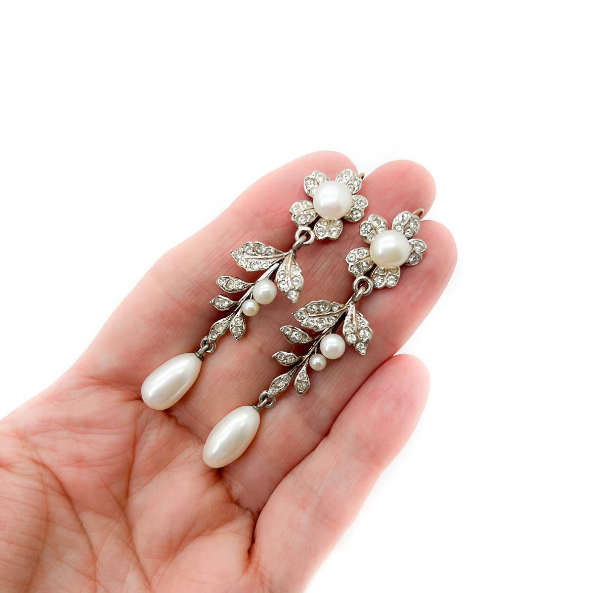 A dreamy pair of Vintage Silver Pearl Floral Earrings. Inspired by the Edwardian era these are an exceptional interpretation in every detail. Crafted in solid sterling silver and adorned with paste chatons and whole and drop freshwater pearls.