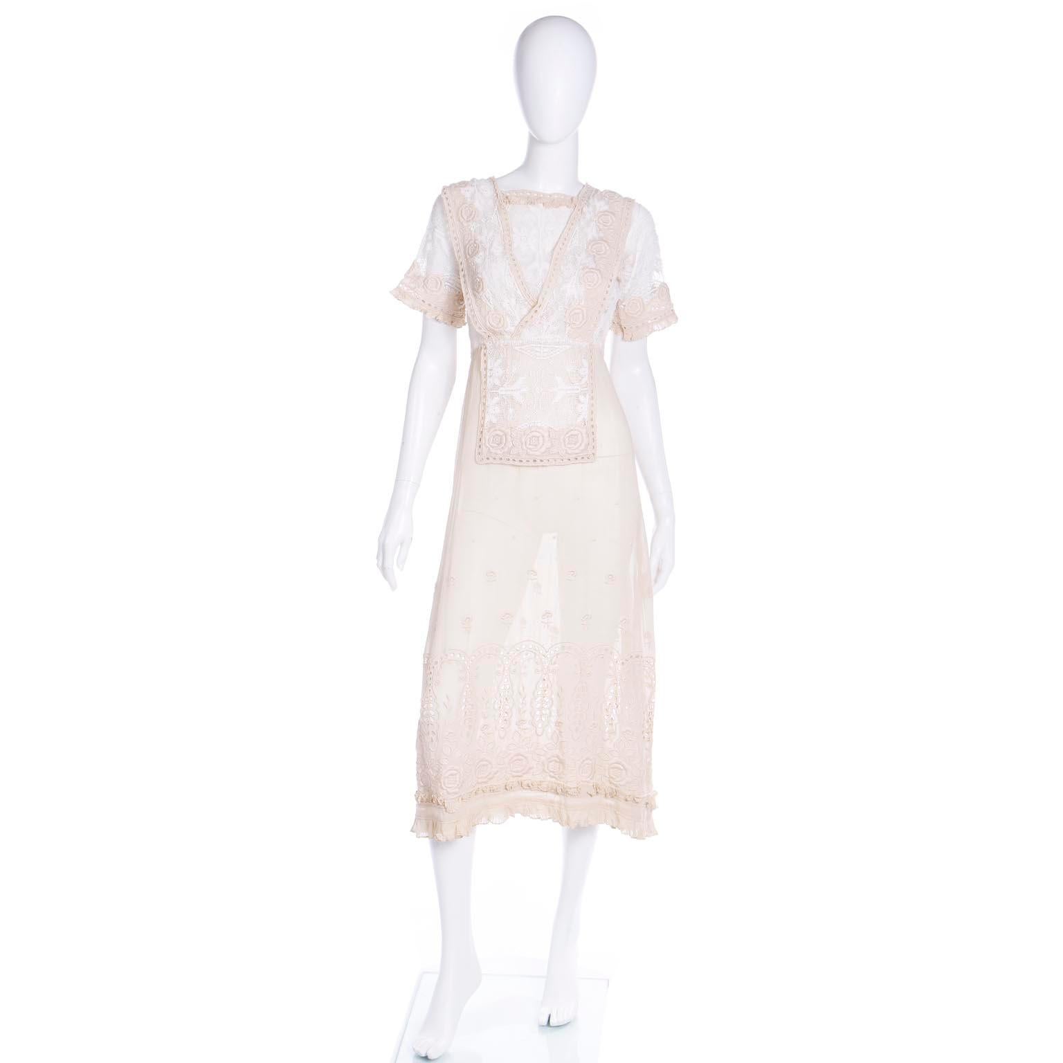 This vintage Edwardian 1910's vintage ivory and cream day dress has incredible floral embroidery, cutwork and lace! The roses on this dress are so lovely and there is a double layer on the bodice with hooks and eyes in the back with so many other