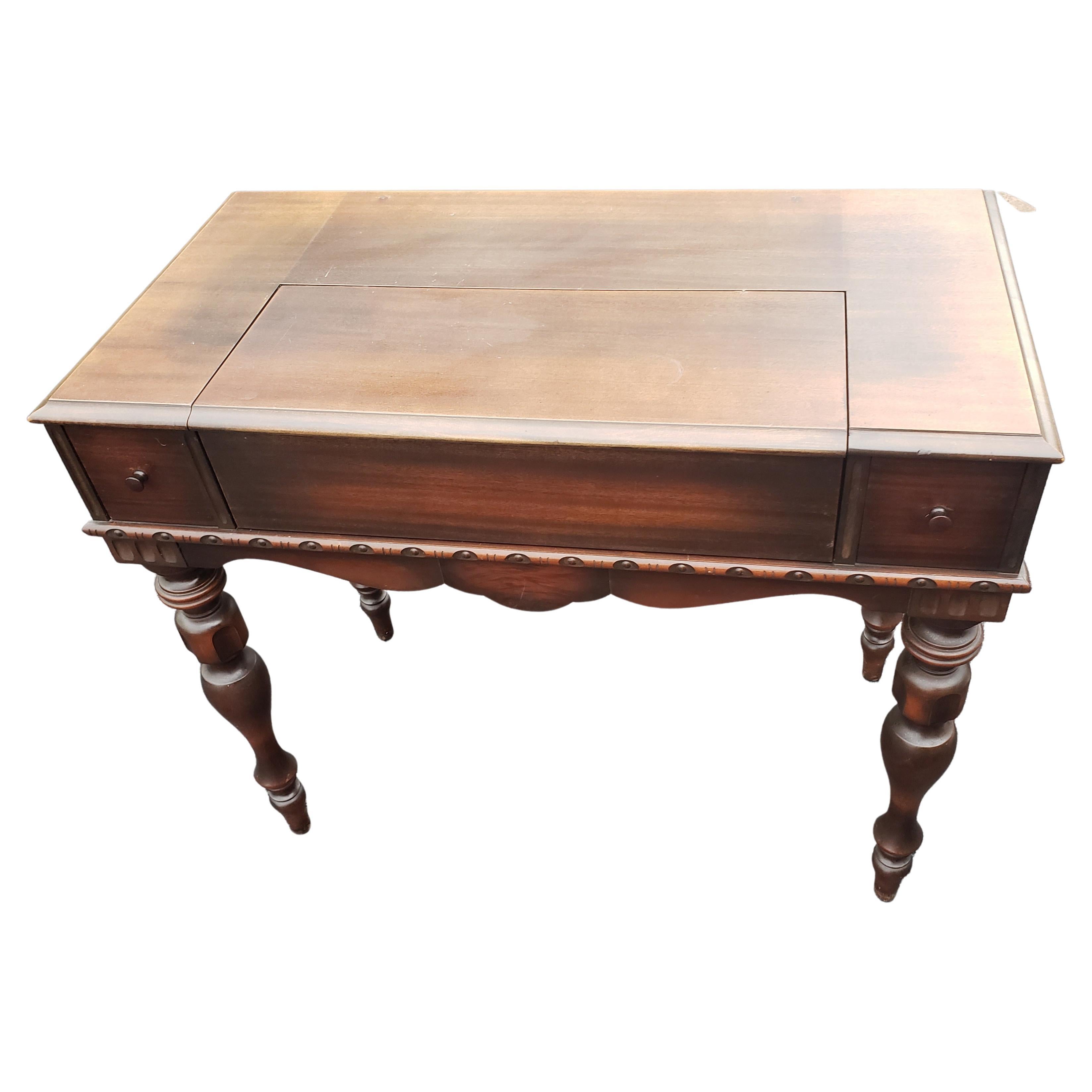 Versatile Edwardian style writing that can be used as console table, Sofa table or as a hall table. Simple yet elegant carving on edges. Pull out tray to make create more writing area. Plenty of storage space with Two Deep dovetailed drawers on each