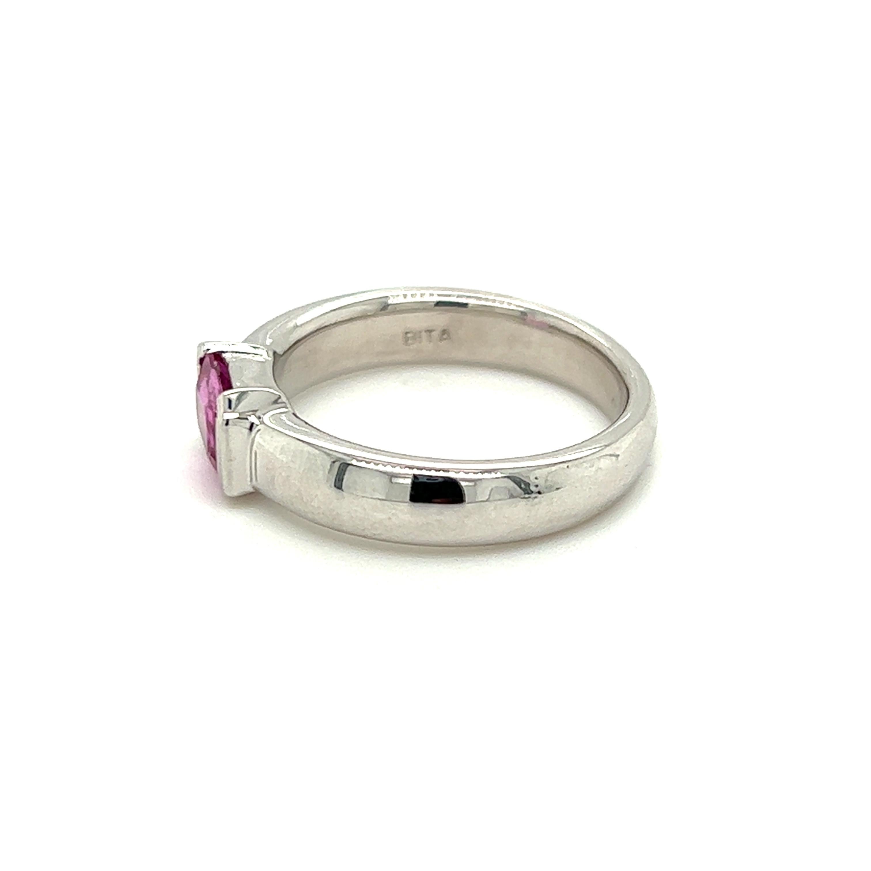 One 14-karat white gold ring, designed by Bita for EFFY,  measuring 4.30mm wide, set with one natural emerald cut pink sapphire measuring approximately 7x5mm. The ring is a finger size 7 and is resizable.  