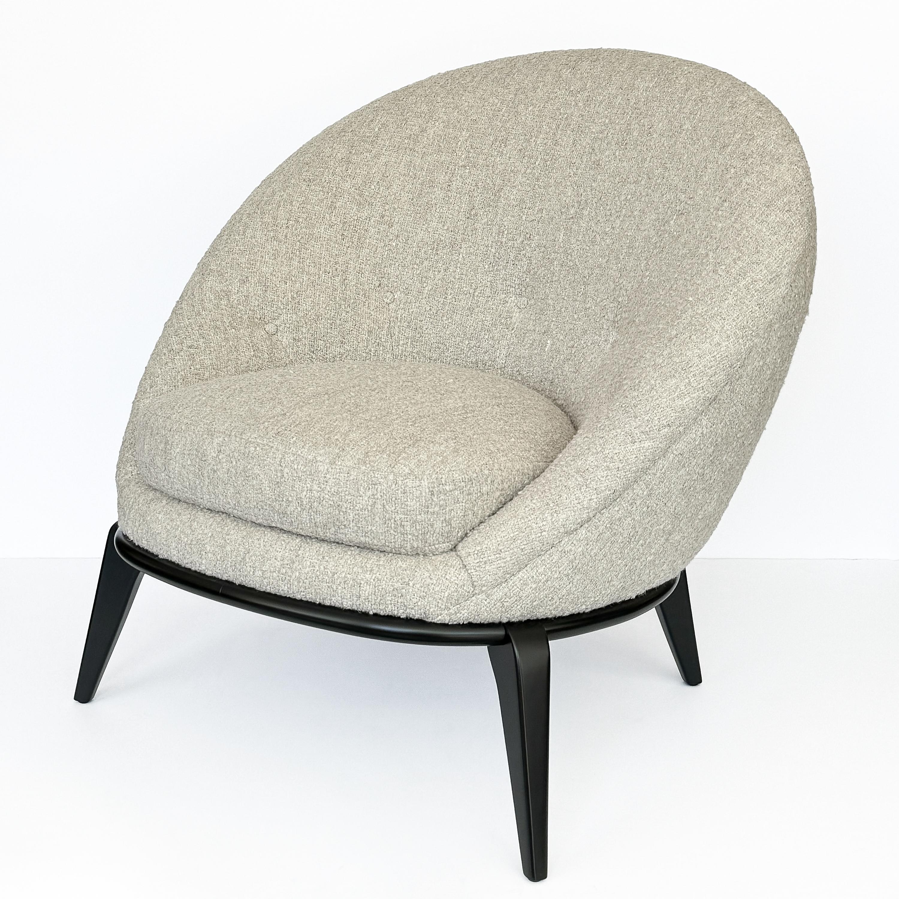 Elevate your living space with this exquisitely restored egg lounge chair, drawing inspiration from the iconic designs of Jean Royère, circa 1960s.

The chair features a unique egg-shaped, spoon-back design that provides supportive and cradles you