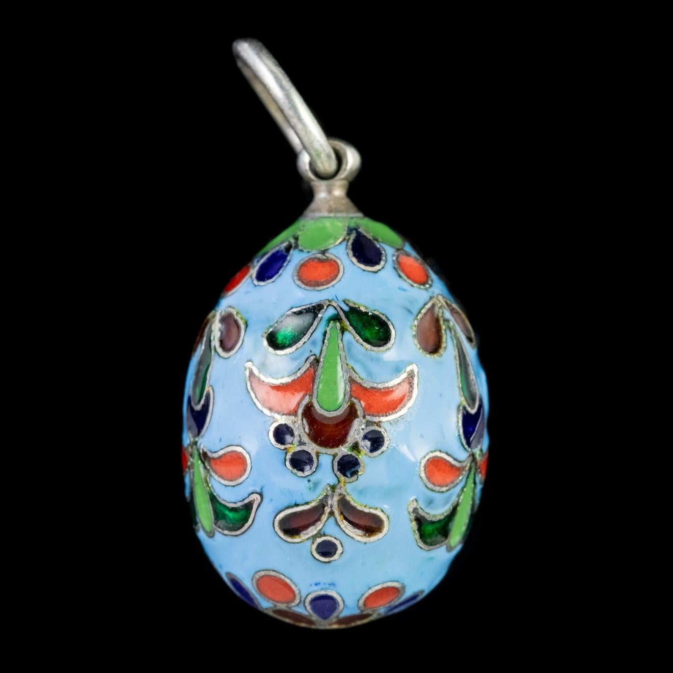 A fabulous little Vintage pendant from the 1930s fashioned in a similar design to that of a Faberge Egg. 

The pendant is decorated in beautiful Enamel workmanship which features colourful foliate motifs upon a pale blue setting. 

The piece is all