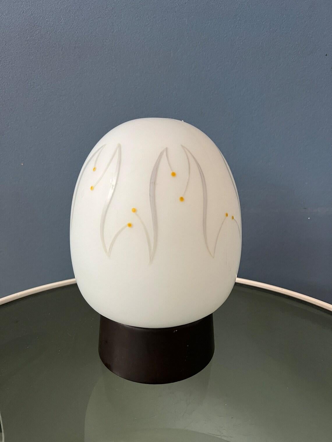 Cute egg-like thabur opaline glass ceiling lamp. The lamp requires an E14 lightbulb.

Additional information:
Materials: Glass, plastic
Period: 1970s
Dimensions:Height: 19 cm
Diameter: 14 cm
Condition: Very good. The lamp is still looking great,
