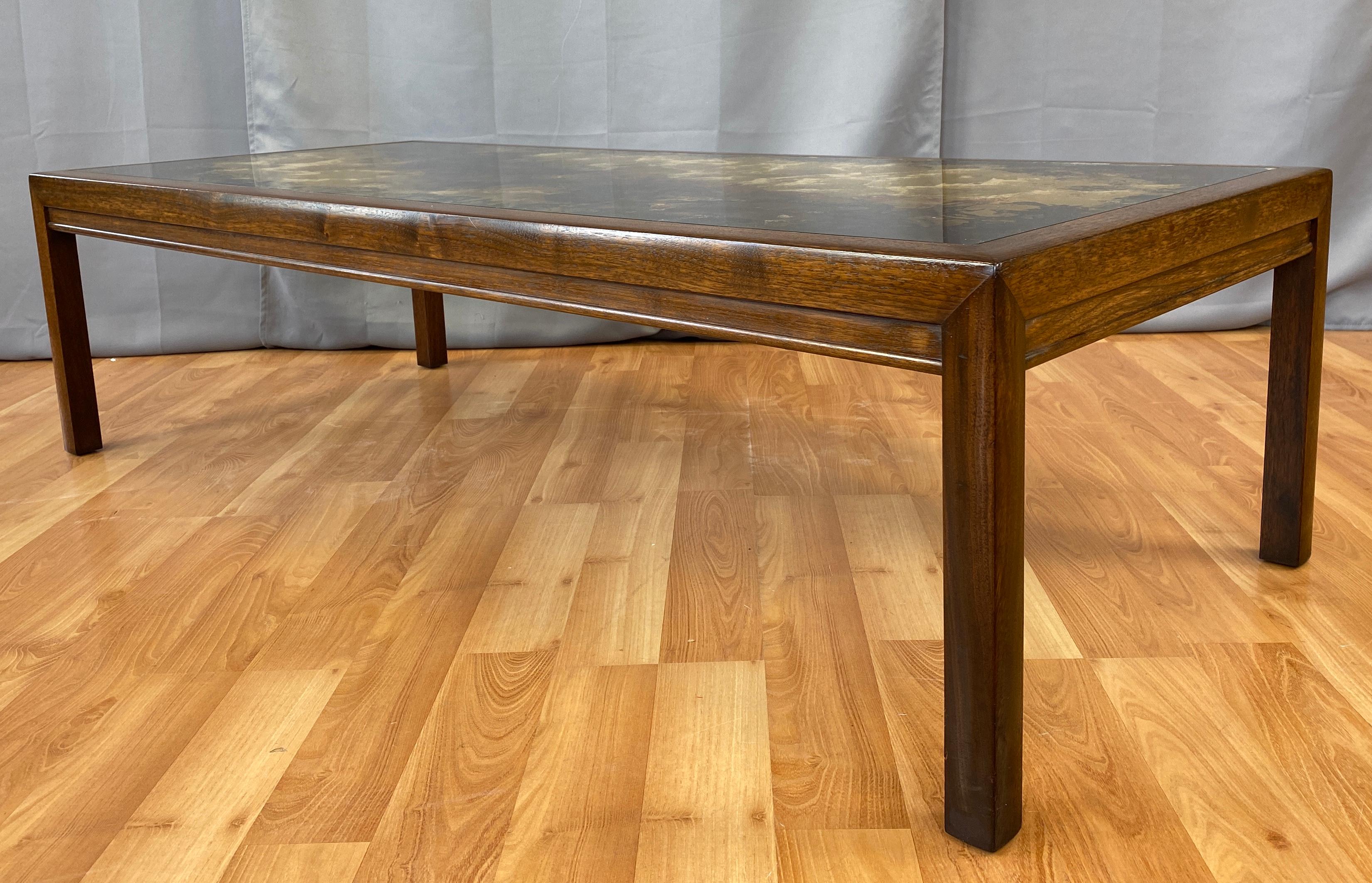 A strikingly elegant coffee table is a masterful work of art, as illustrated by this 1970s bespoke piece with elements that remind us of certain designs by John Keal for Brown-Saltman.

Gold leaf and paint applied with skillful technique and an