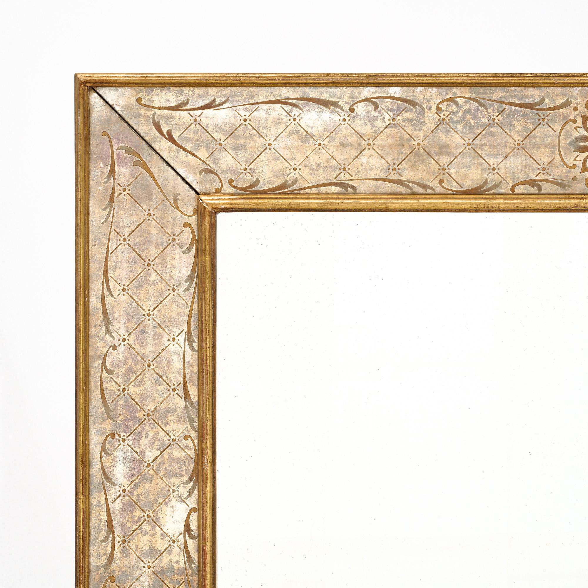 Mirror, French, made with an eglomised (gold leafed and painted on the rear side of the mirror) border. It has a 24 carat gold leafed frame and the original central mirror.
